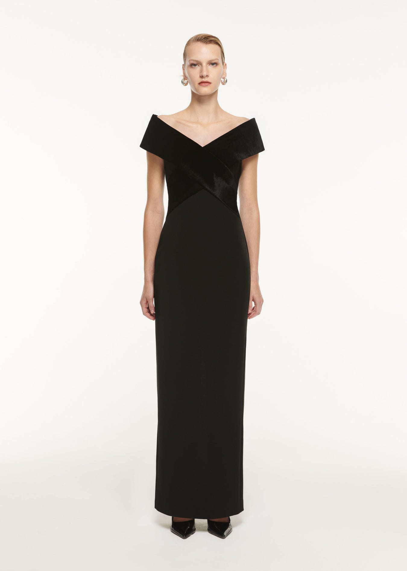 A woman wearing the Off The Shoulder Stretch Cady Maxi Dress Black