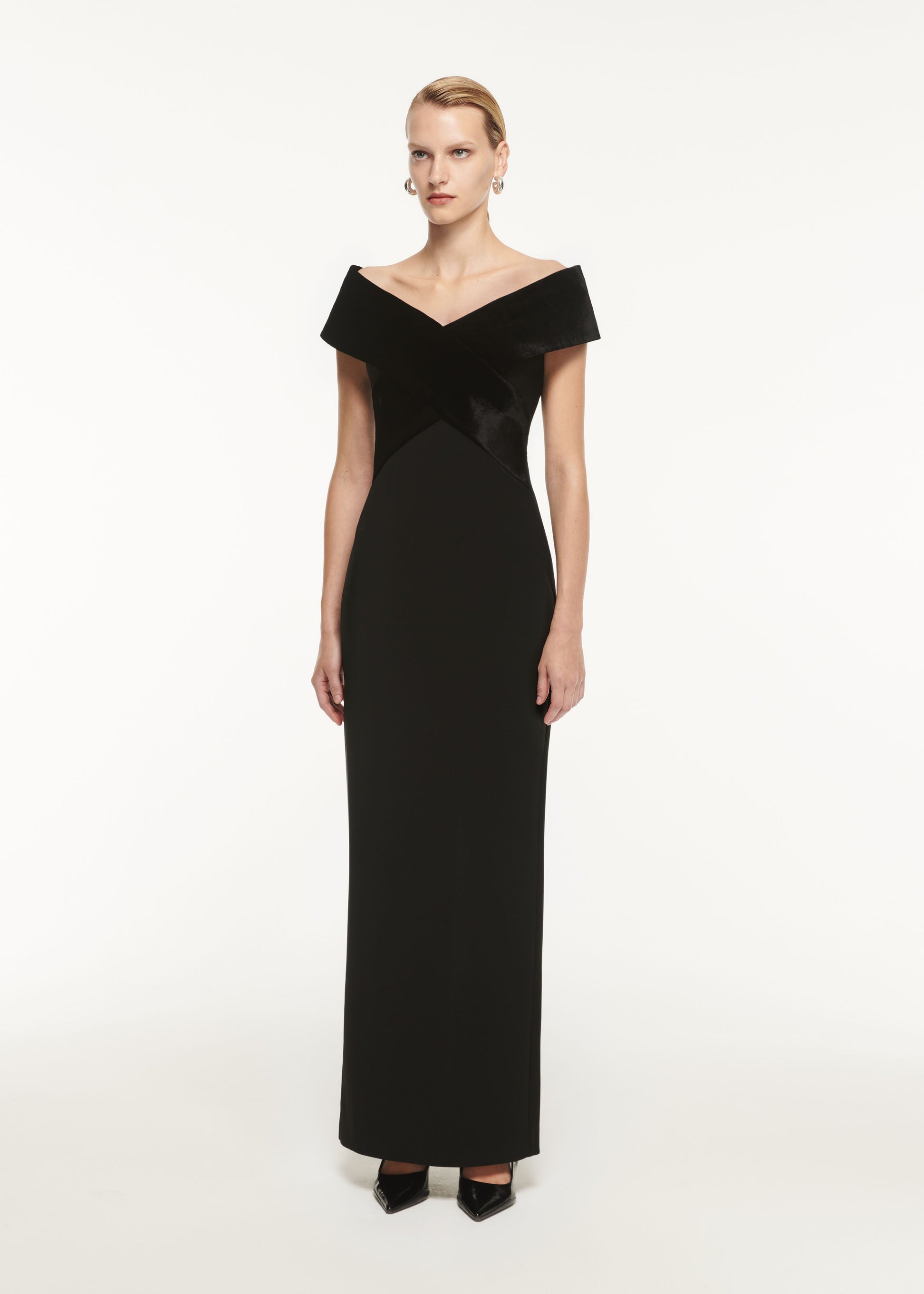 A woman wearing the Off The Shoulder Stretch Cady Maxi Dress Black