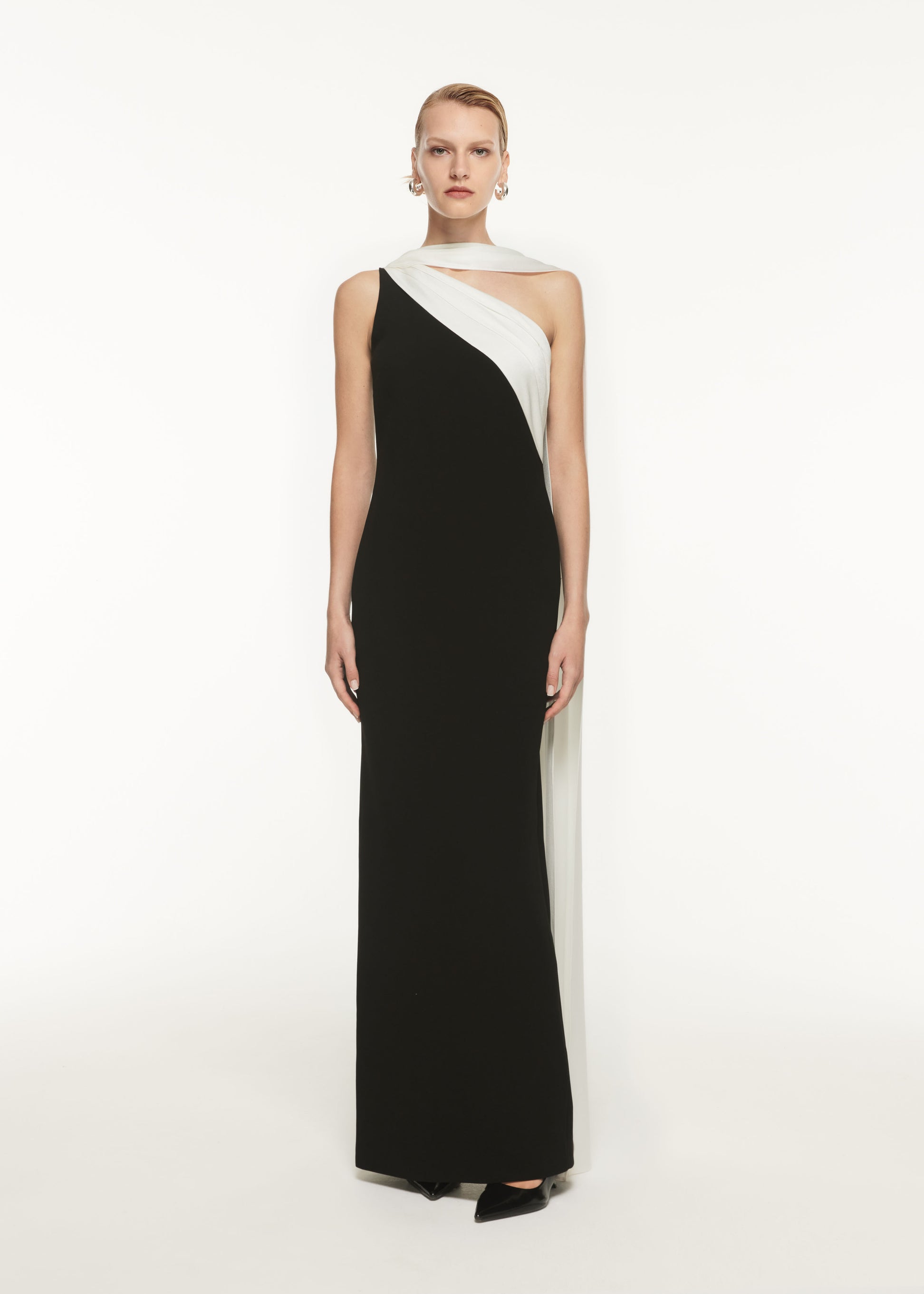 A woman wearing the Asymmetric Satin Sash Maxi Dress