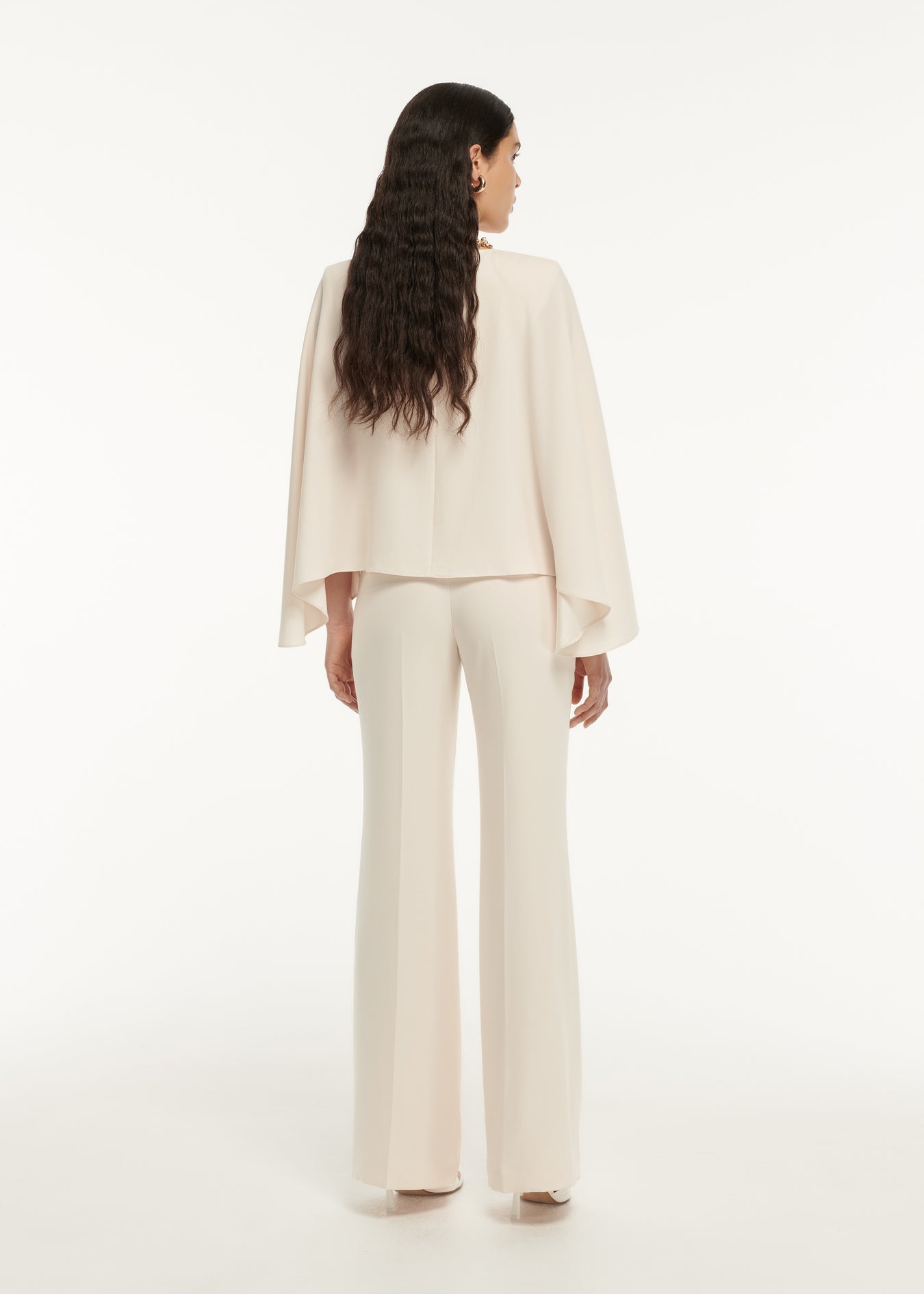 The back of a woman wearing the Long Sleeve Satin Crepe Top