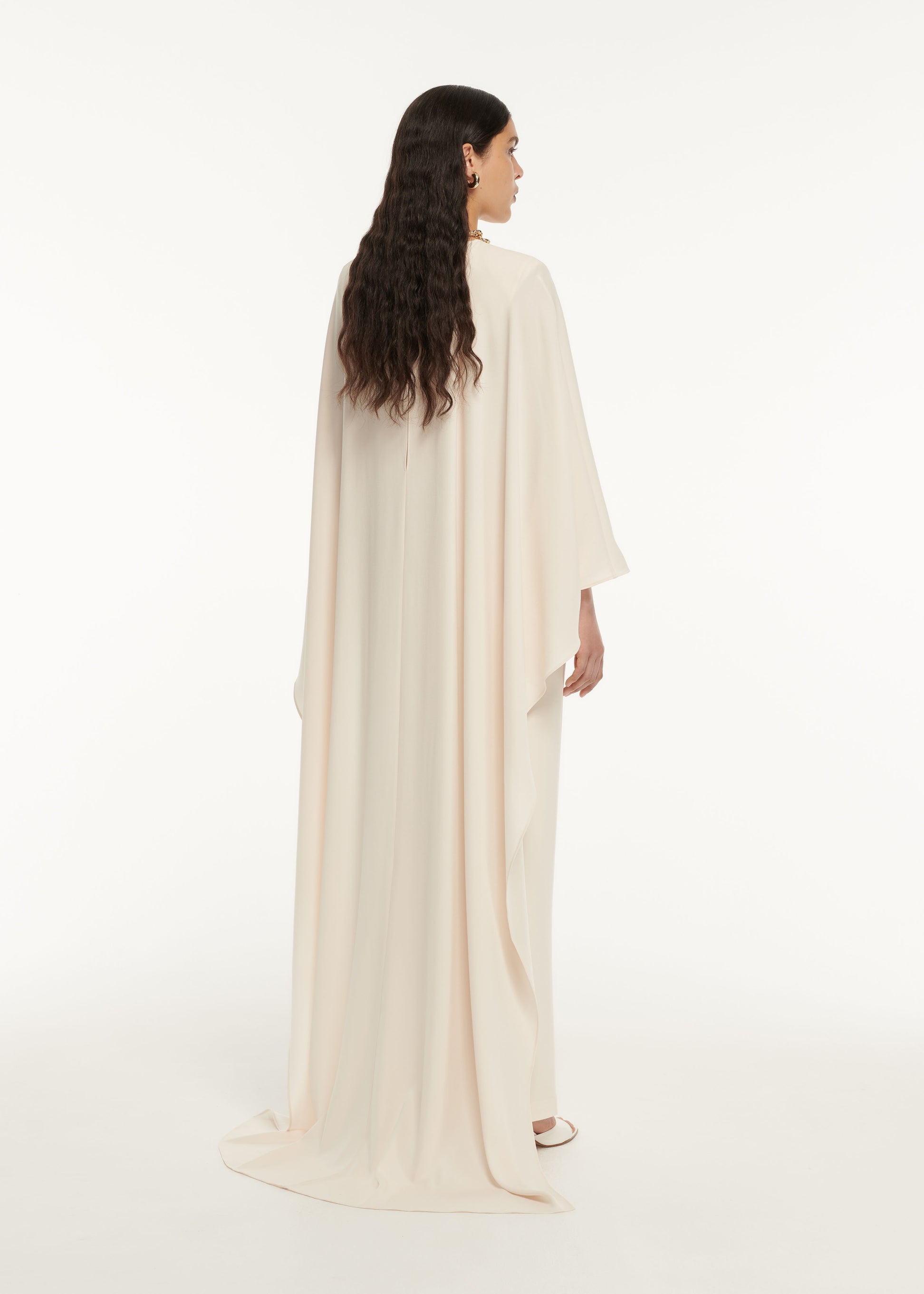 The back of a woman wearing the Long Sleeve Satin Crepe Midi Dress