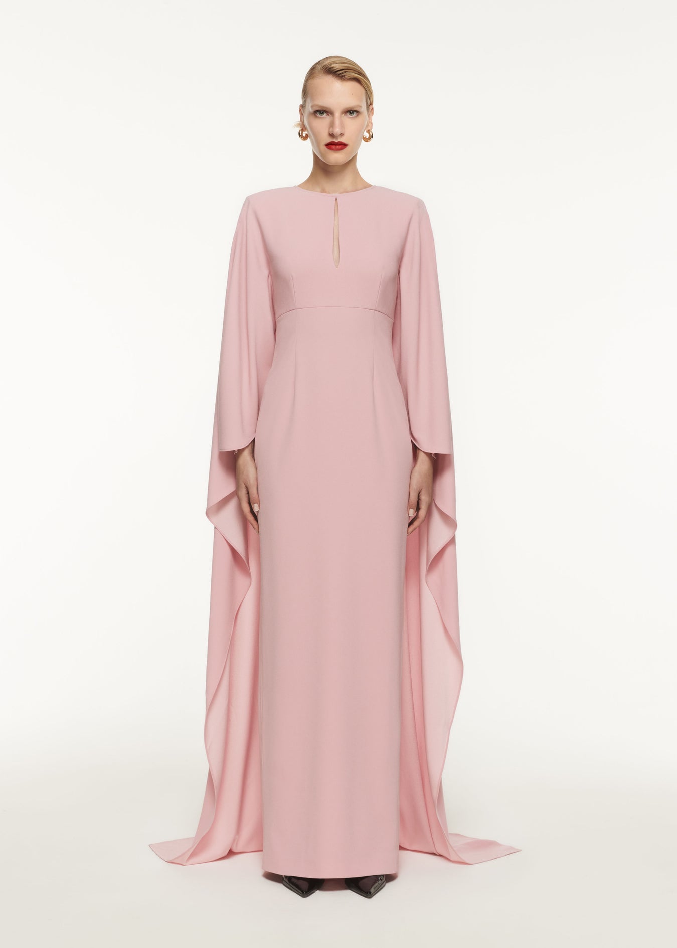 A woman wearing the Long Sleeve Satin Crepe Maxi Dress in Pink