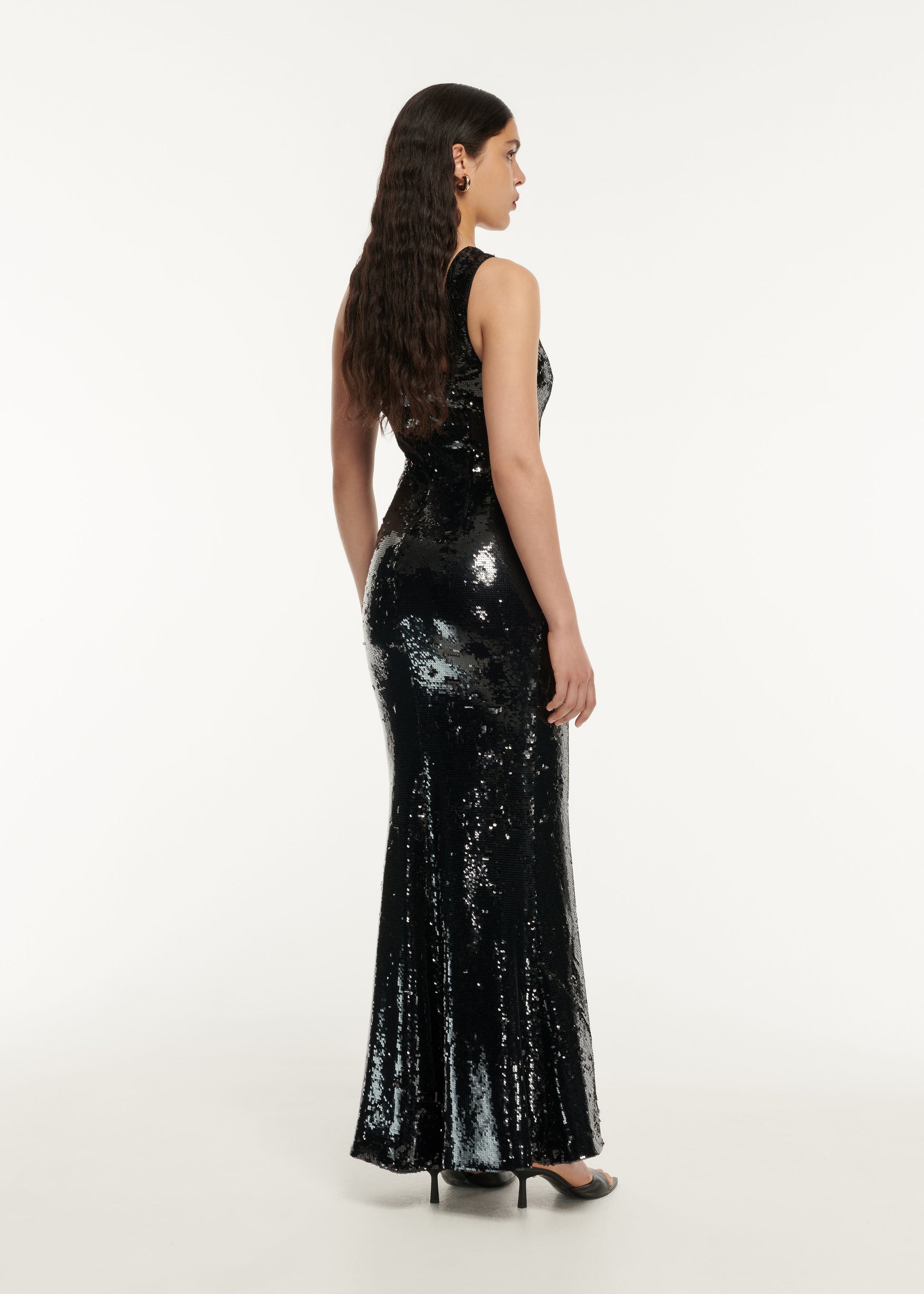 The back of a woman wearing the Cape Satin Crepe Maxi Dress