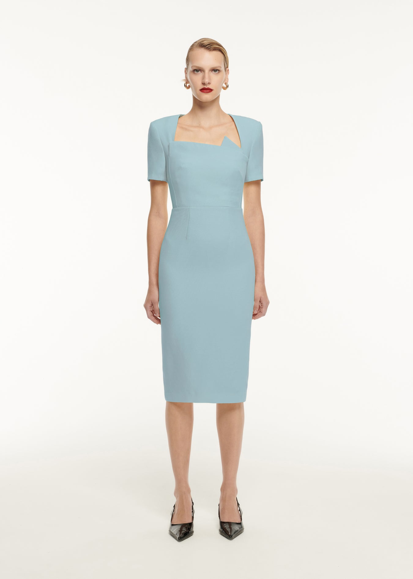 A woman wearing the Short Sleeve Pleat Detail Wool Silk Midi Dress