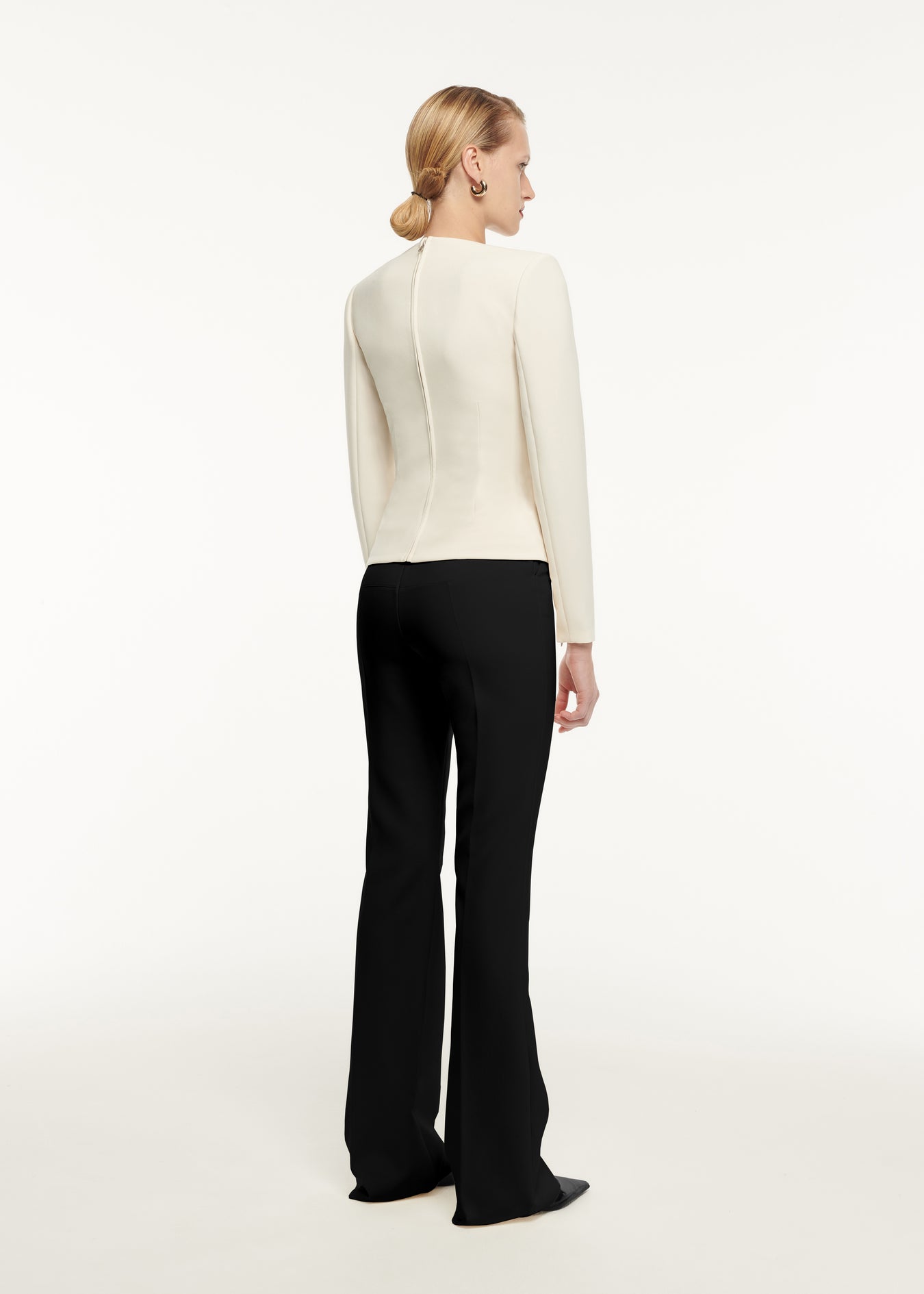 The back of a woman wearing the Long Sleeve Drape Detail Crepe Top