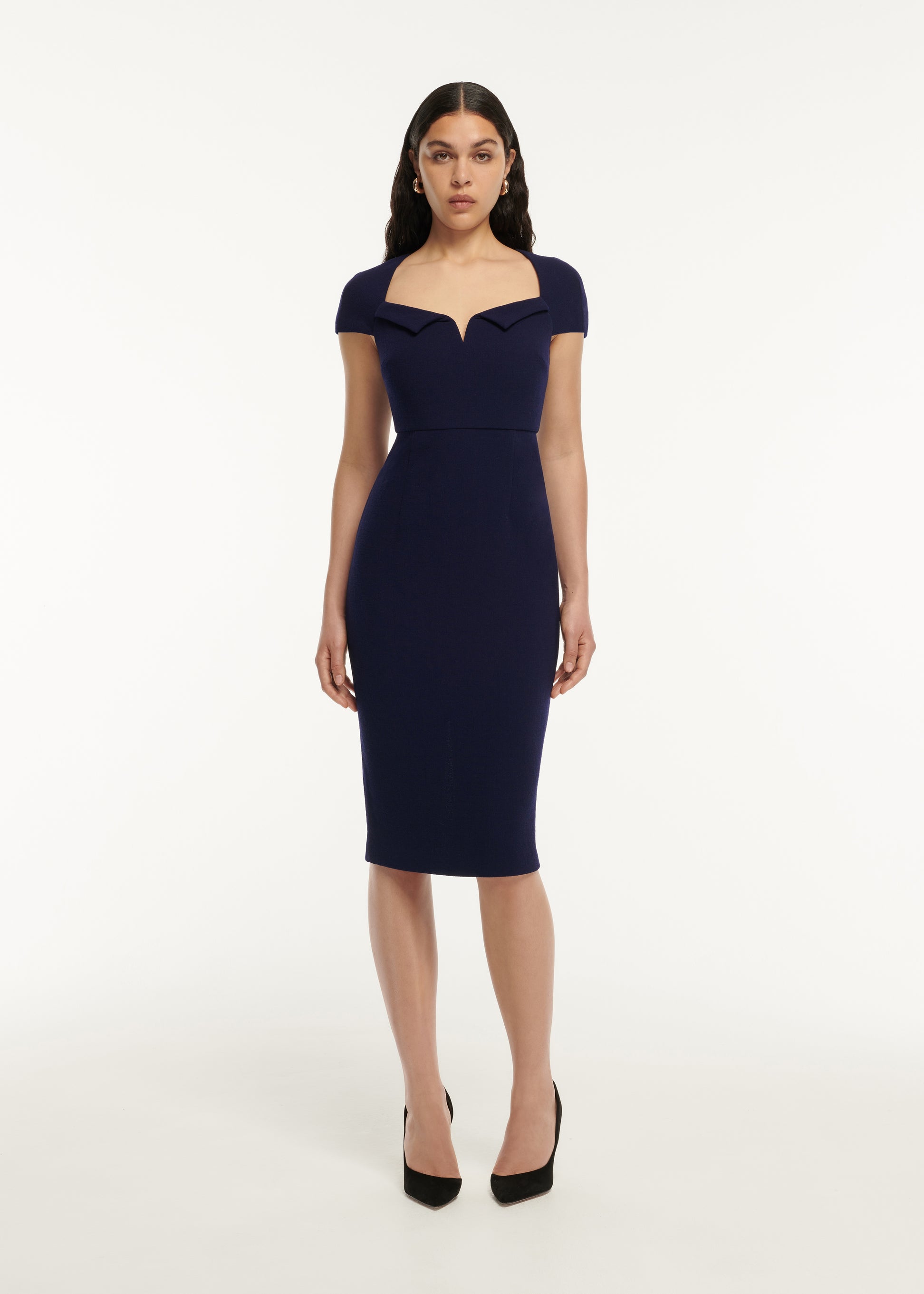 A woman wearing the Cap Sleeve Fitted Wool Crepe Midi Dress