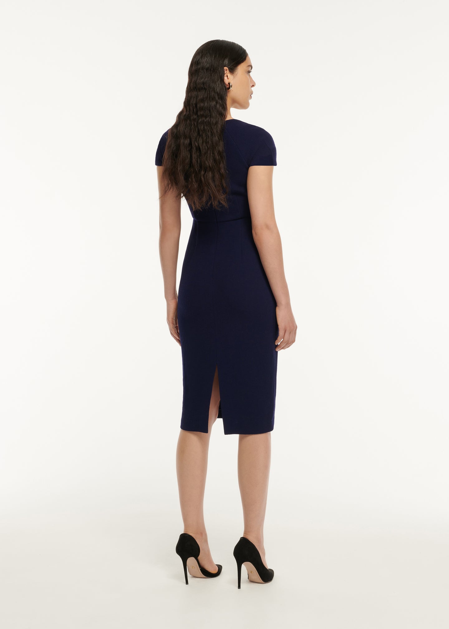 The back of a woman wearing the Cap Sleeve Fitted Wool Crepe Midi Dress