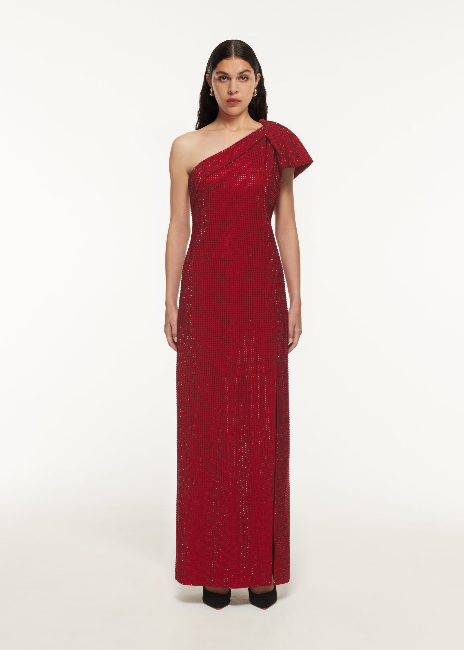 A woman wearing the Asymmetric Diamante Maxi Dress