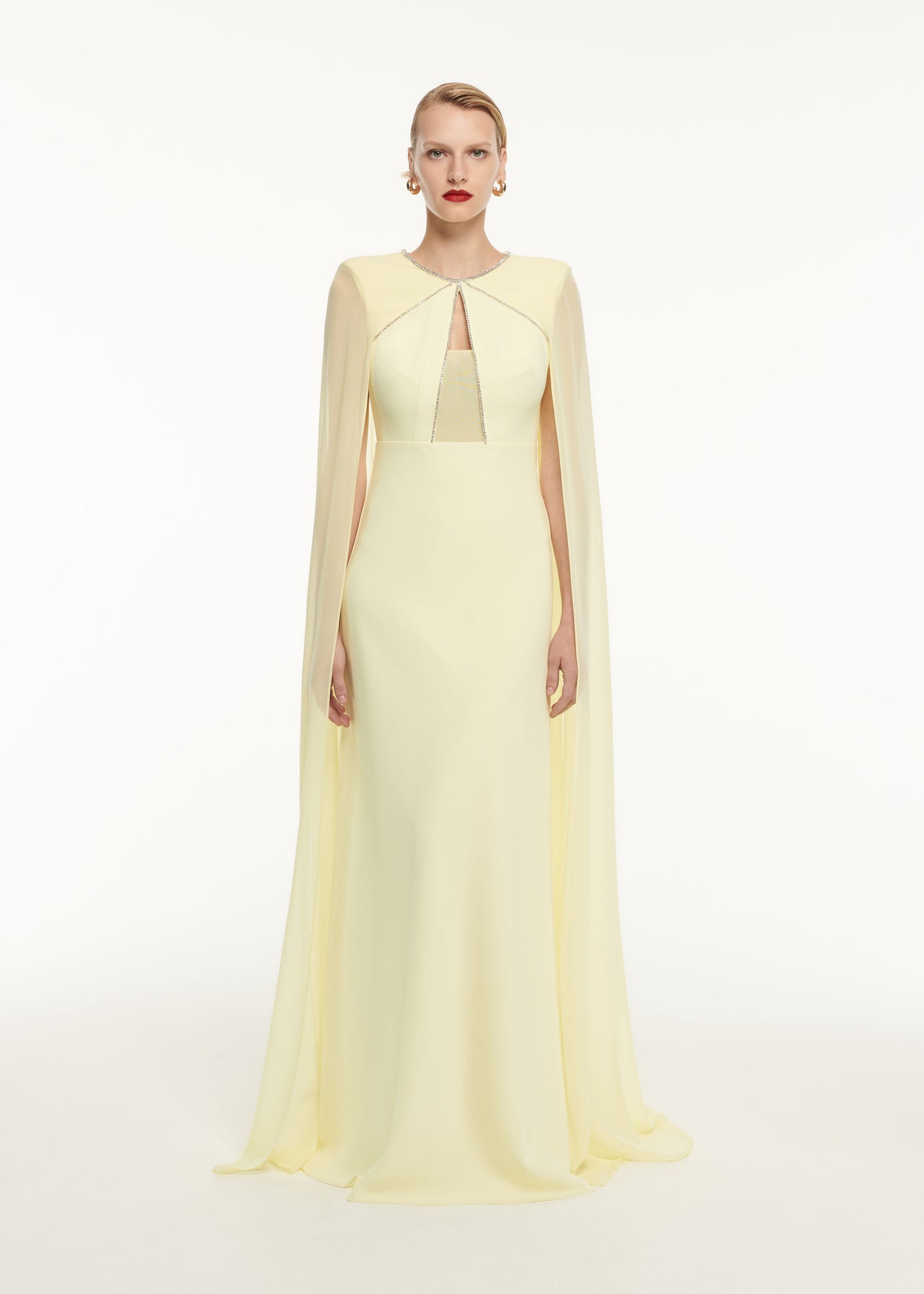 A woman wearing the Stretch Cady Gown in Yellow