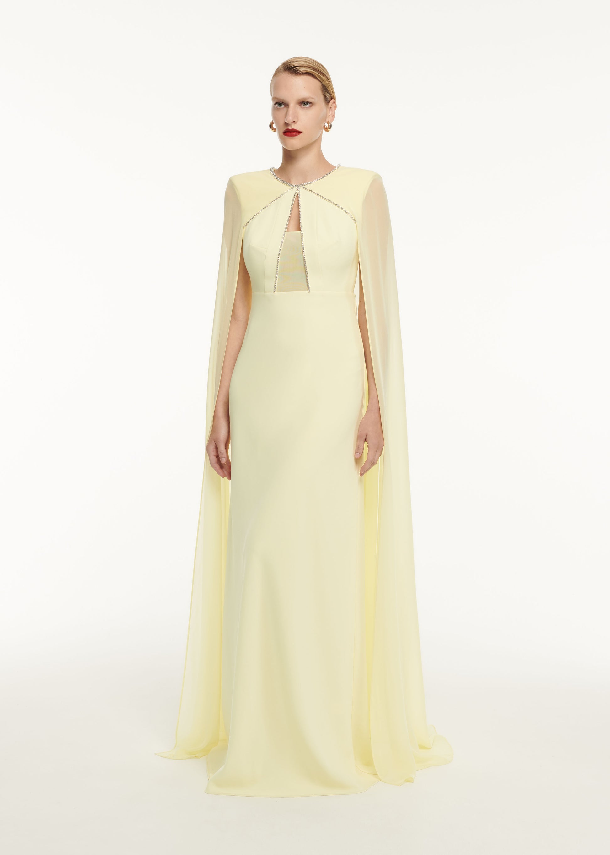 A woman wearing the Stretch Cady Gown Yellow