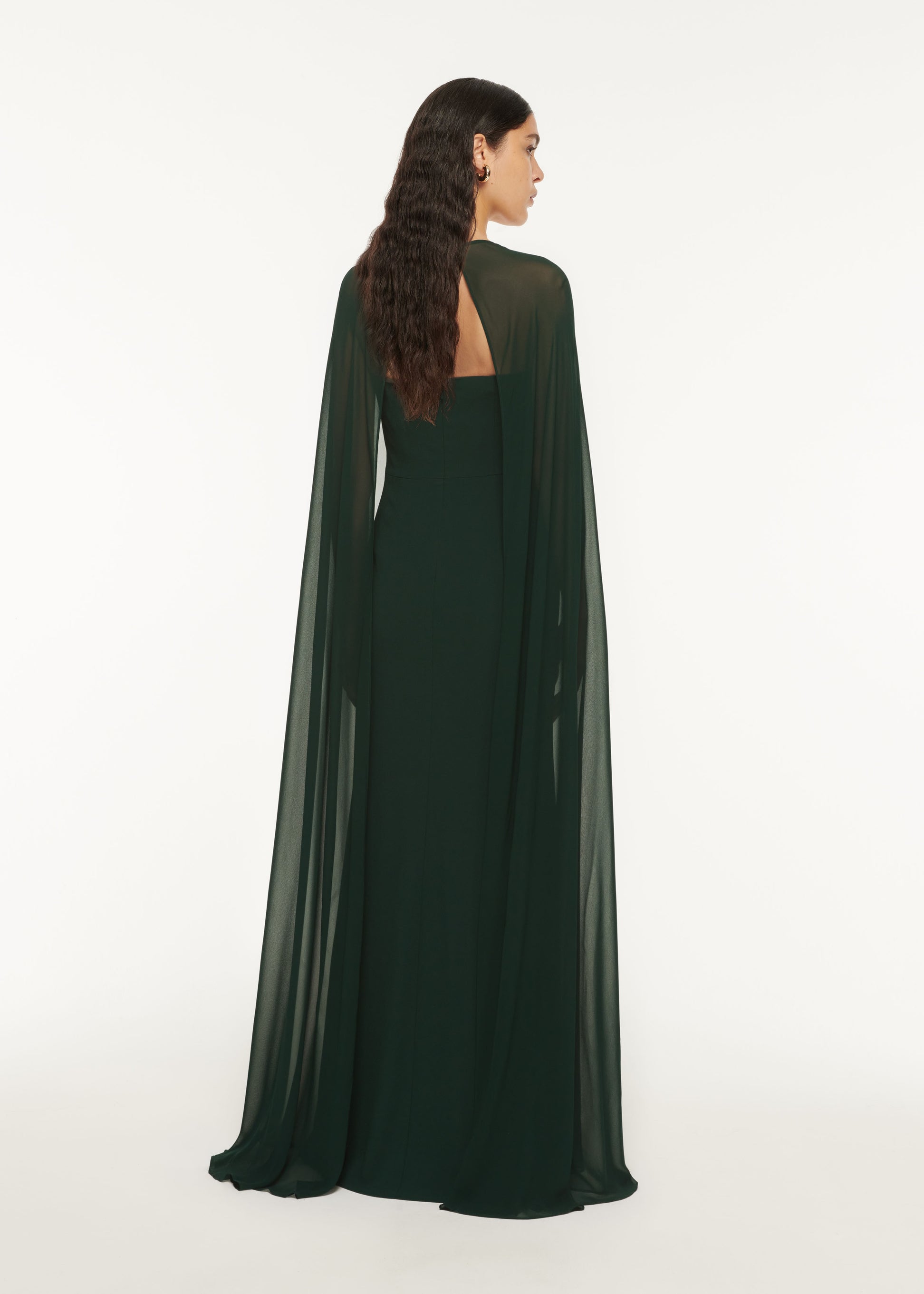 The back of a woman wearing the Strapless Satin Crepe Gown Green