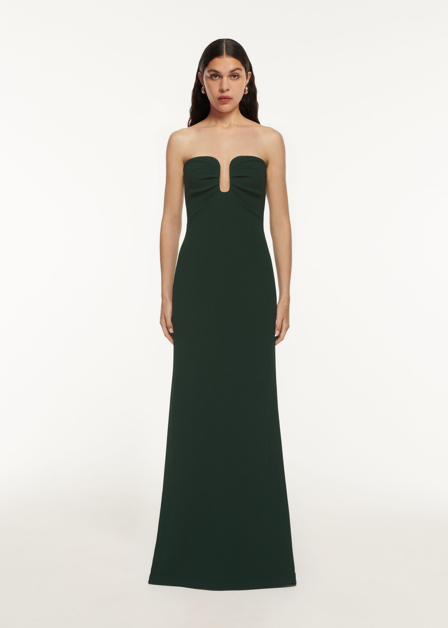 A woman wearing the Strapless Satin Crepe Gown Green