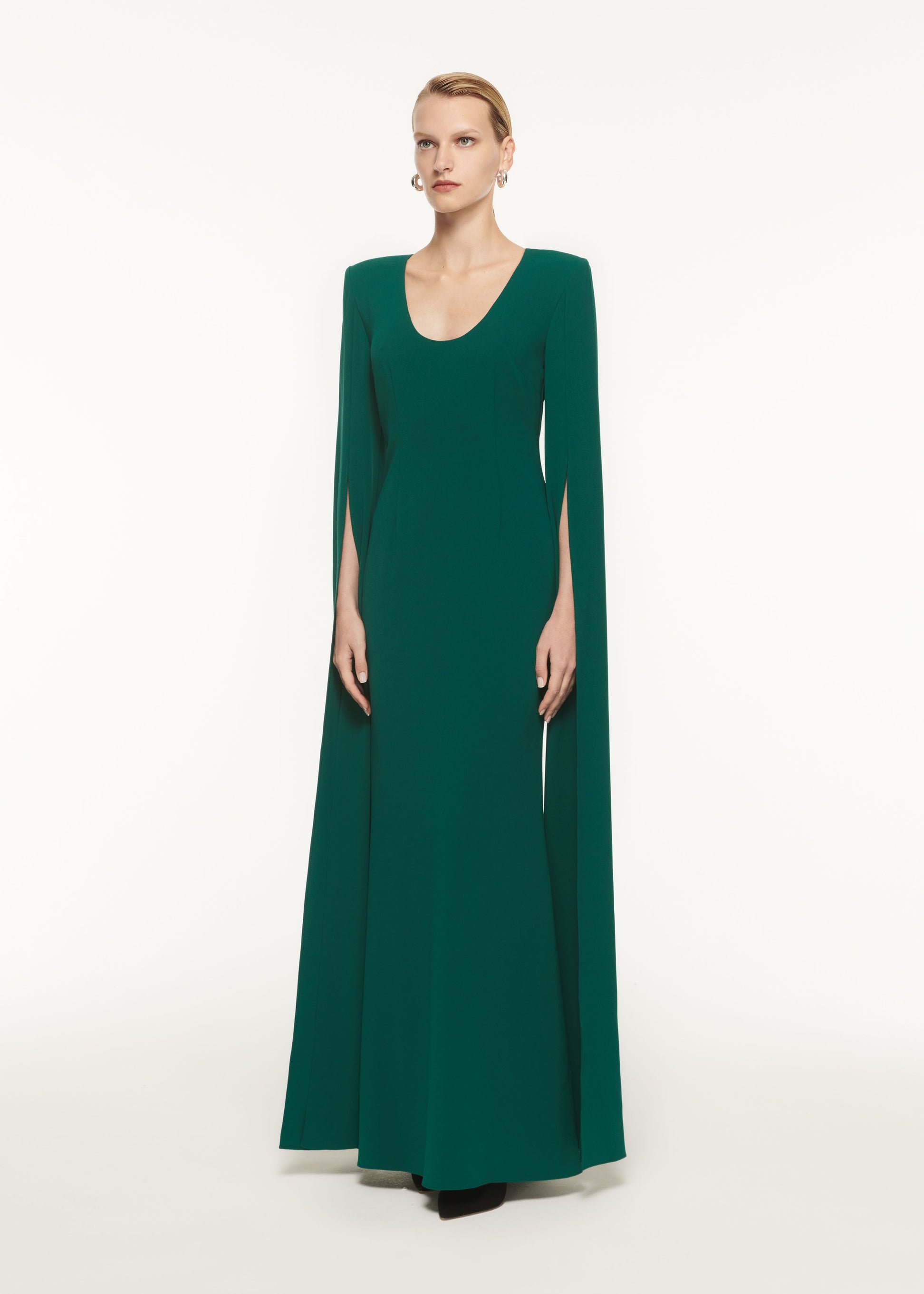 A woman wearing the Cape Sleeve Stretch Cady Maxi Dress