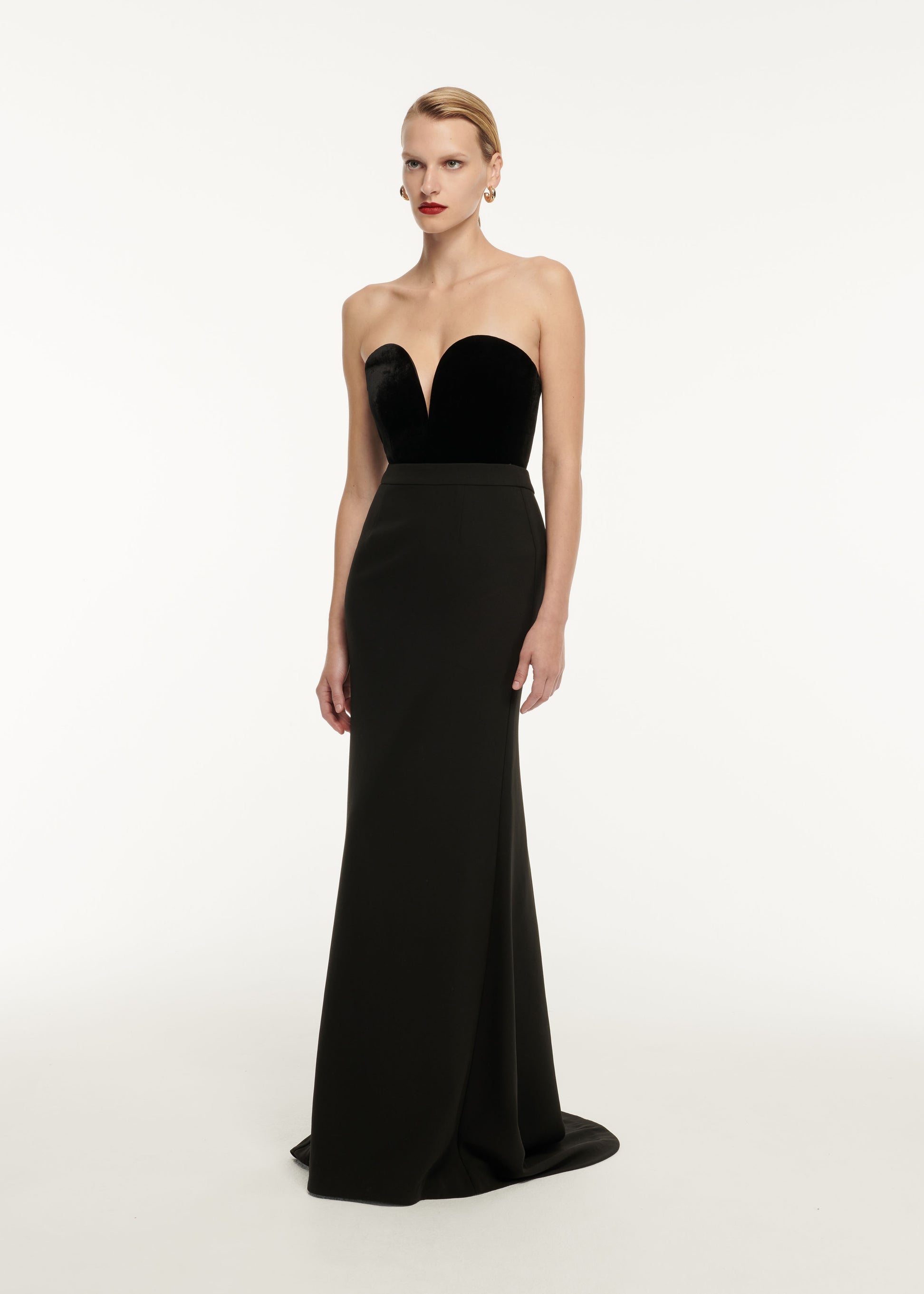 A woman wearing the Strapless Velvet Top Black