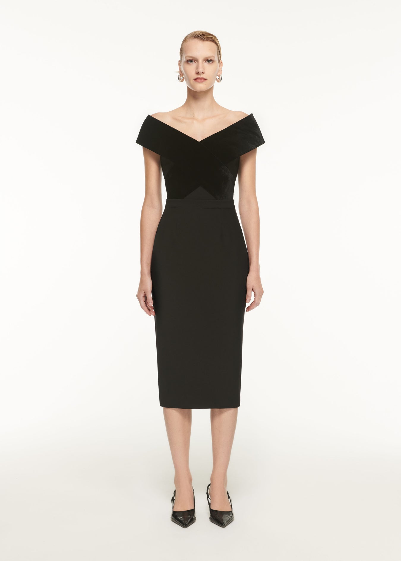 A woman wearing the Crepe Midi Skirt in Black
