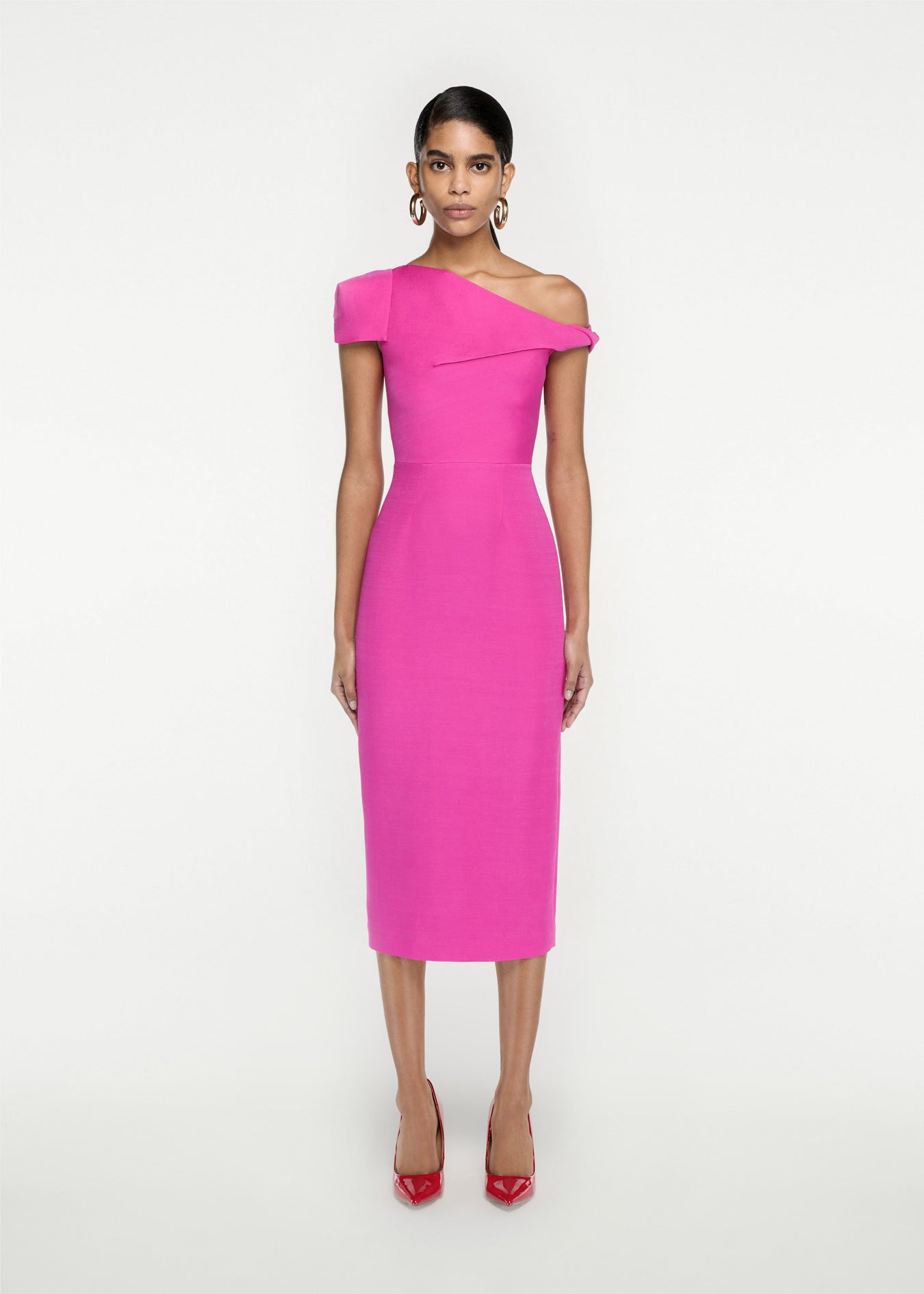 Woman wearing the Asymmetric Silk Wool Midi Dress in Pink