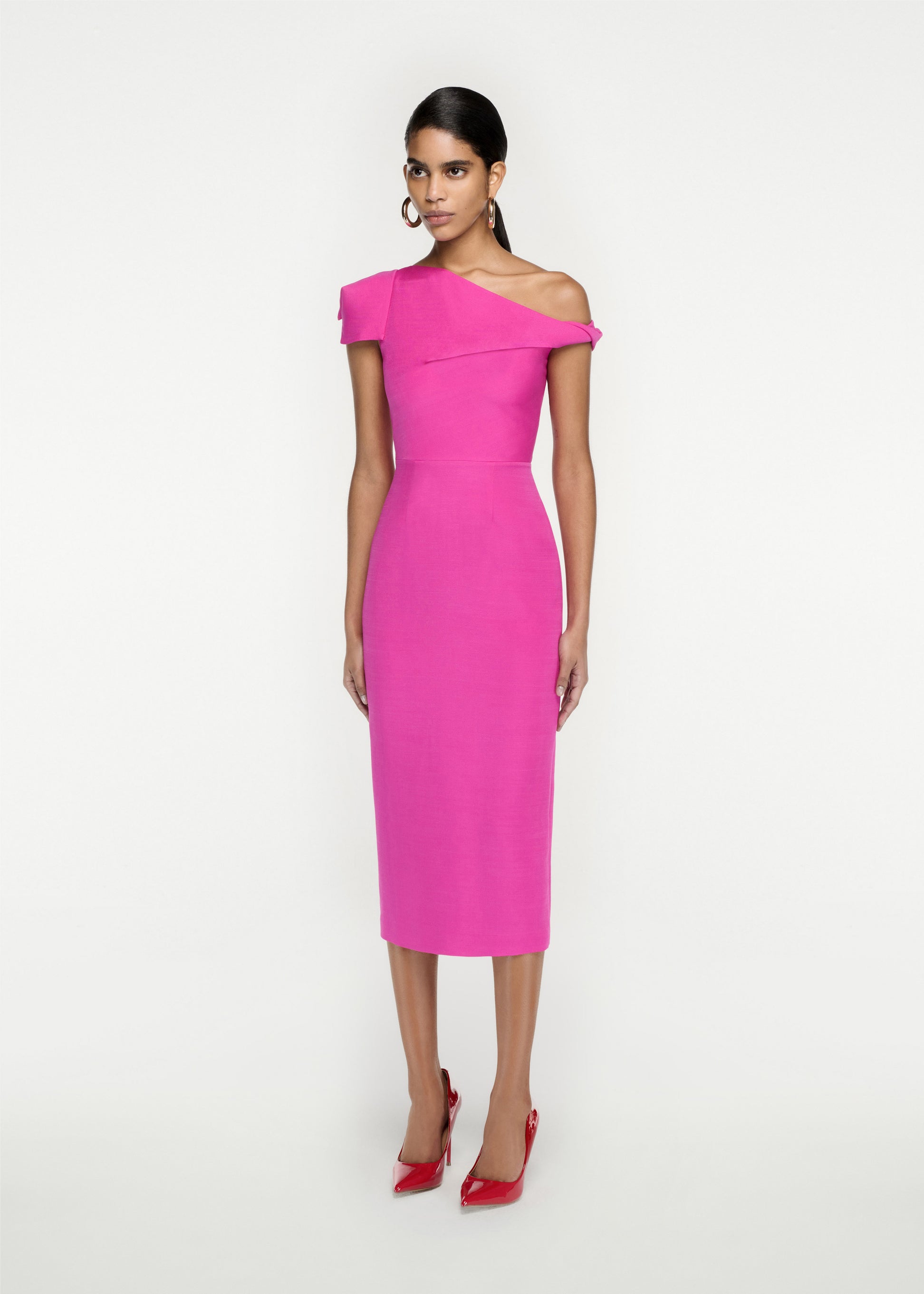 Woman wearing the Asymmetric Silk Wool Midi Dress in Pink
