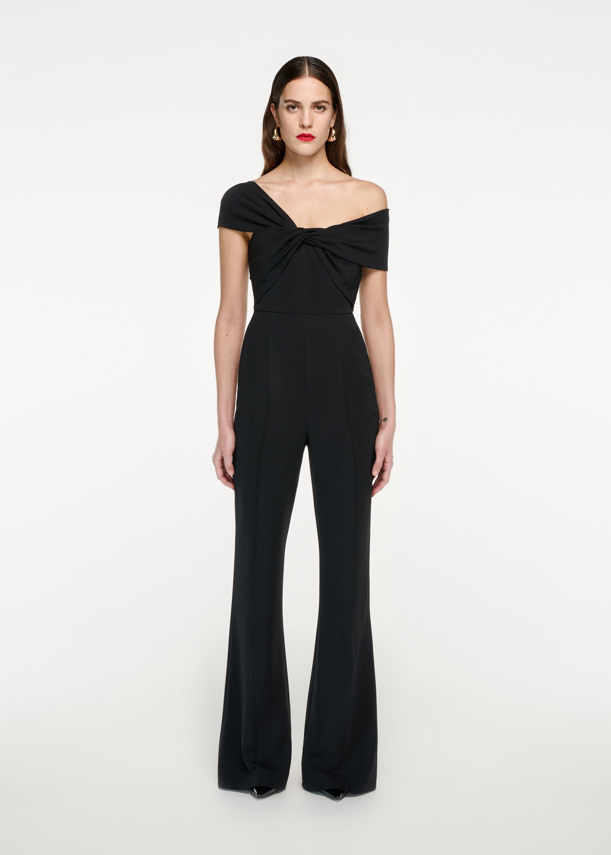 Woman wearing the Asymmetric Stretch Cady Jumpsuit in Black