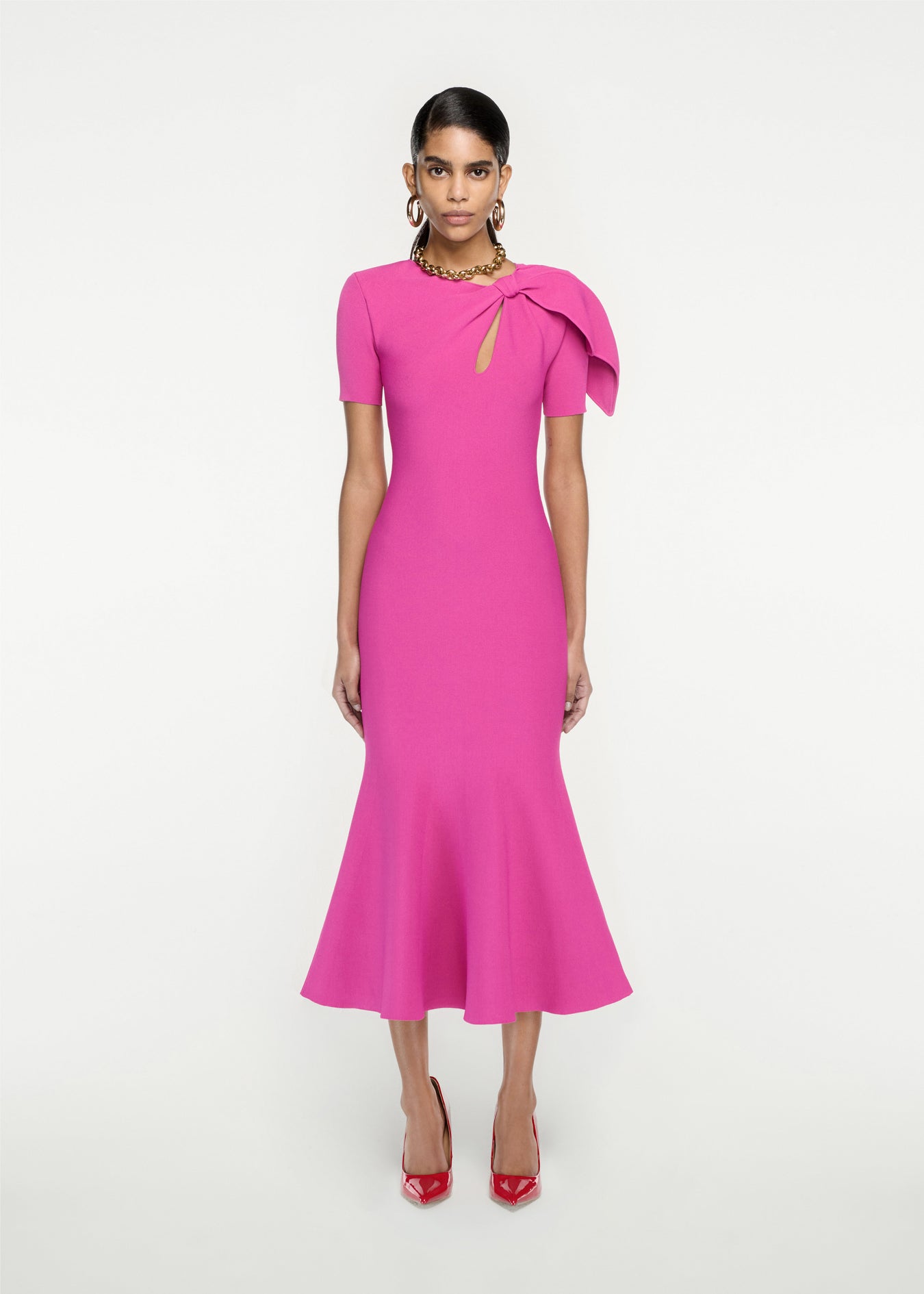 Woman wearing the Short Sleeve Knit Midi Dress in Pink