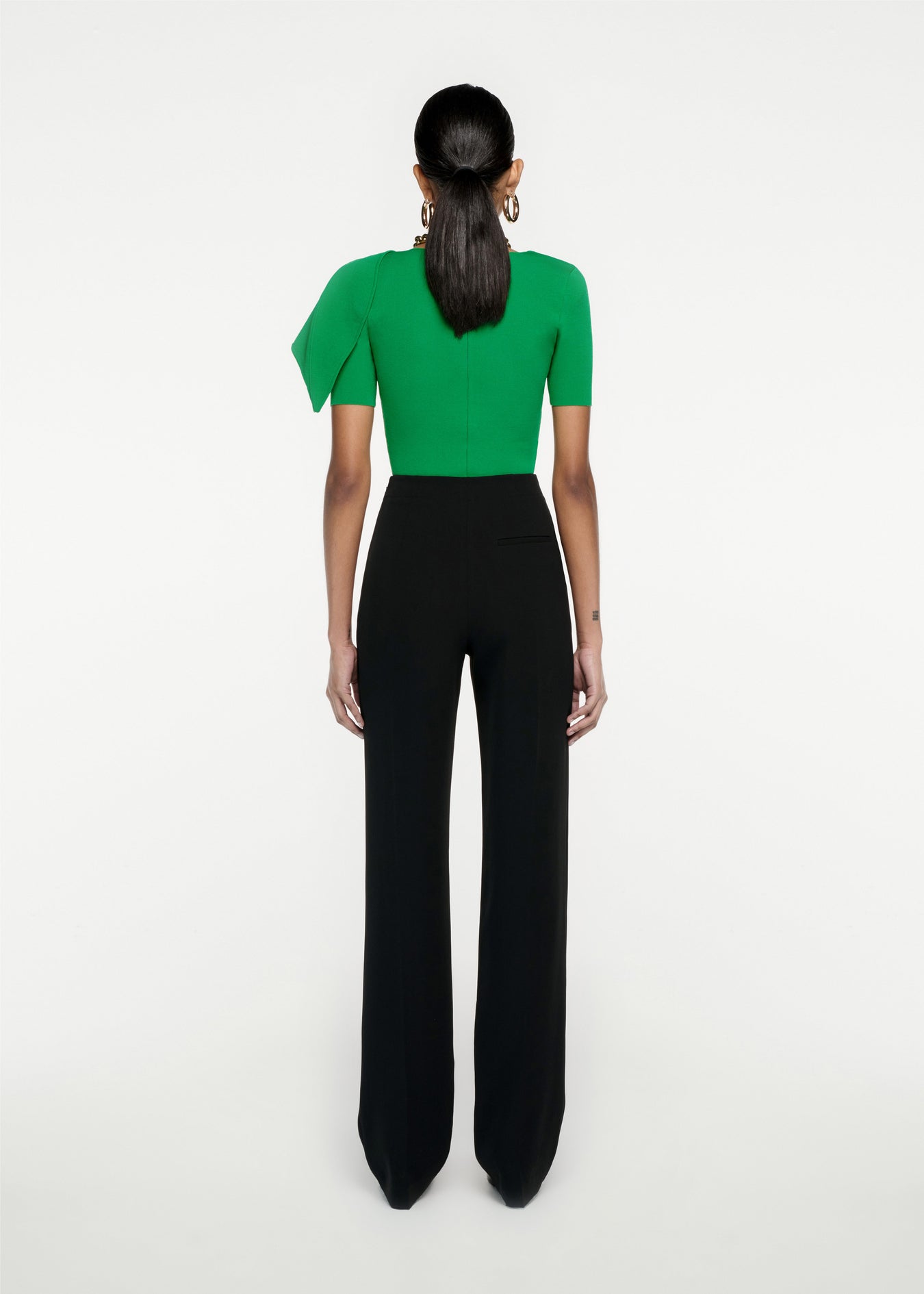 Woman wearing the Short Sleeve Knit Top in Green