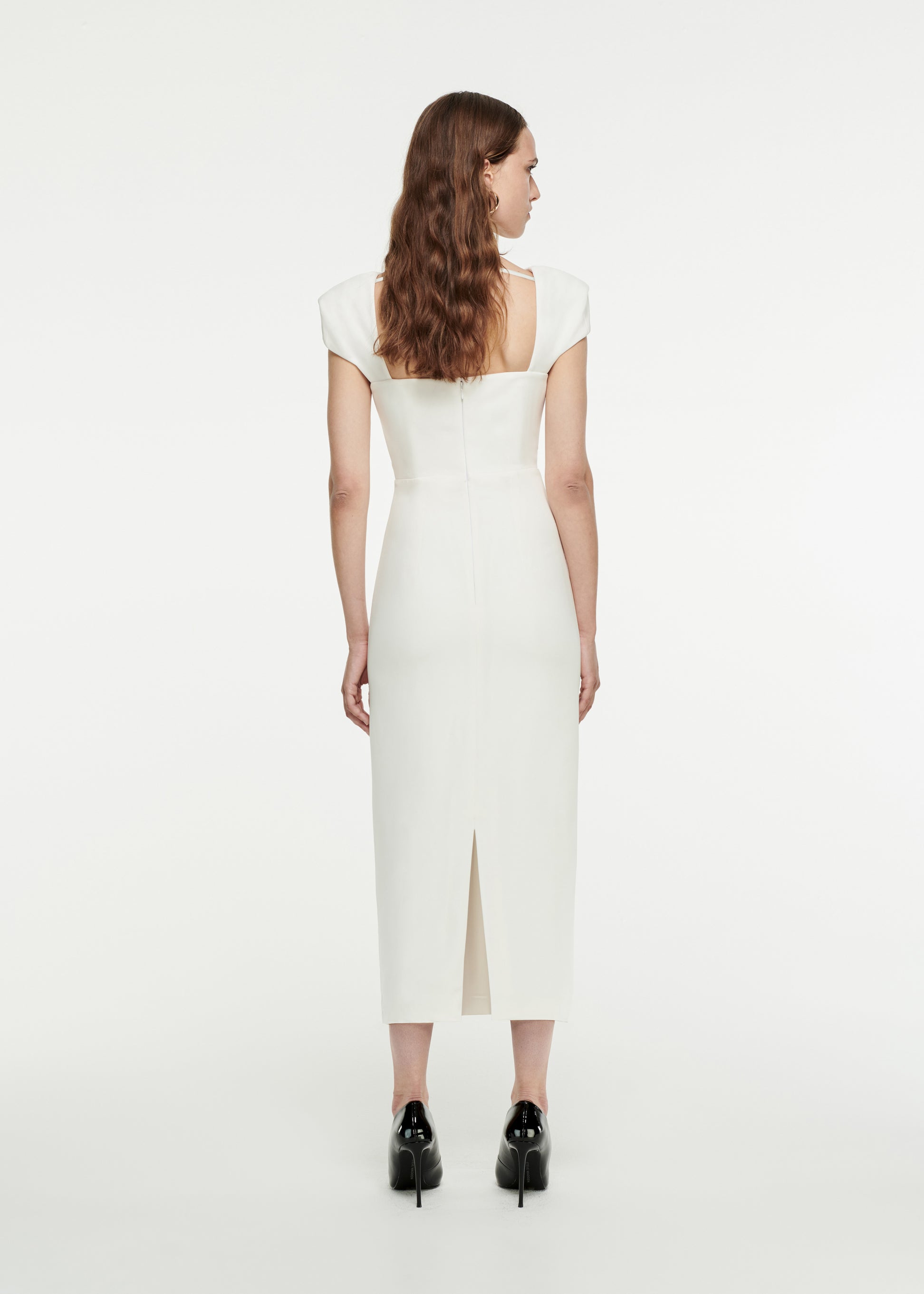 The back of a woman wearing the Cap Sleeve Stretch-Cady Midi Dress in White 