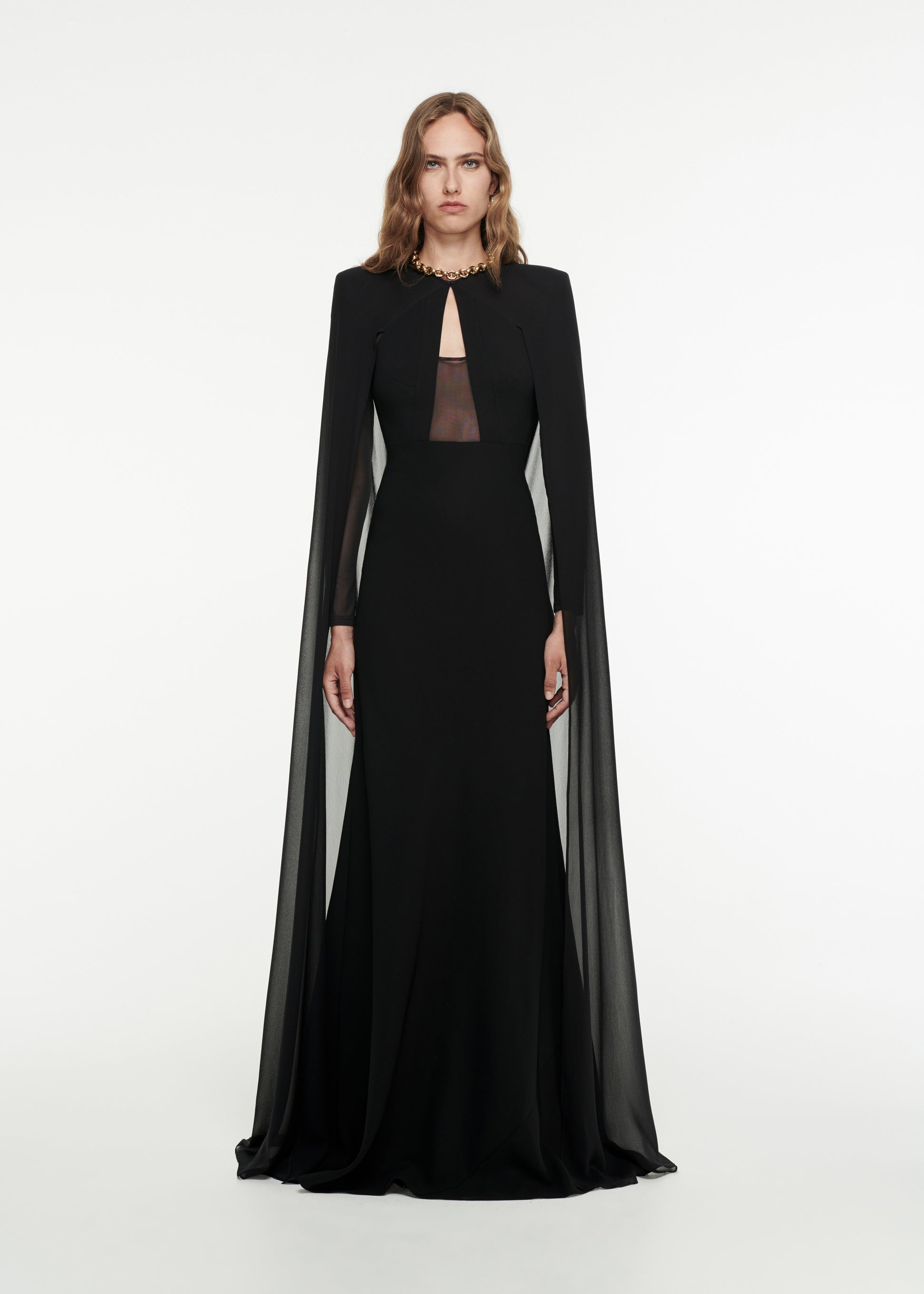 Woman wearing the Long Sleeve Cape Gown in Black