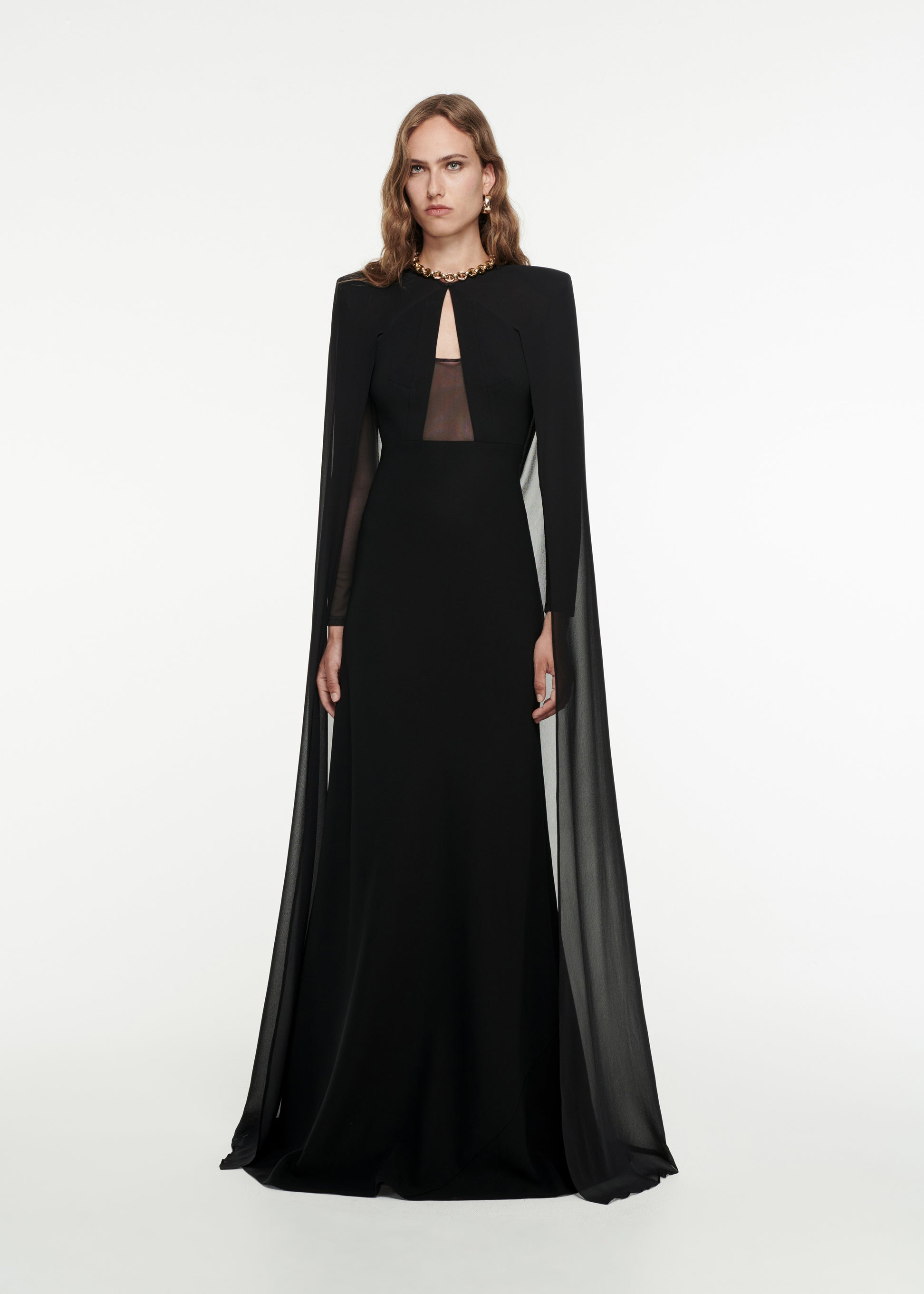 Woman wearing the Long Sleeve Cape Gown in Black