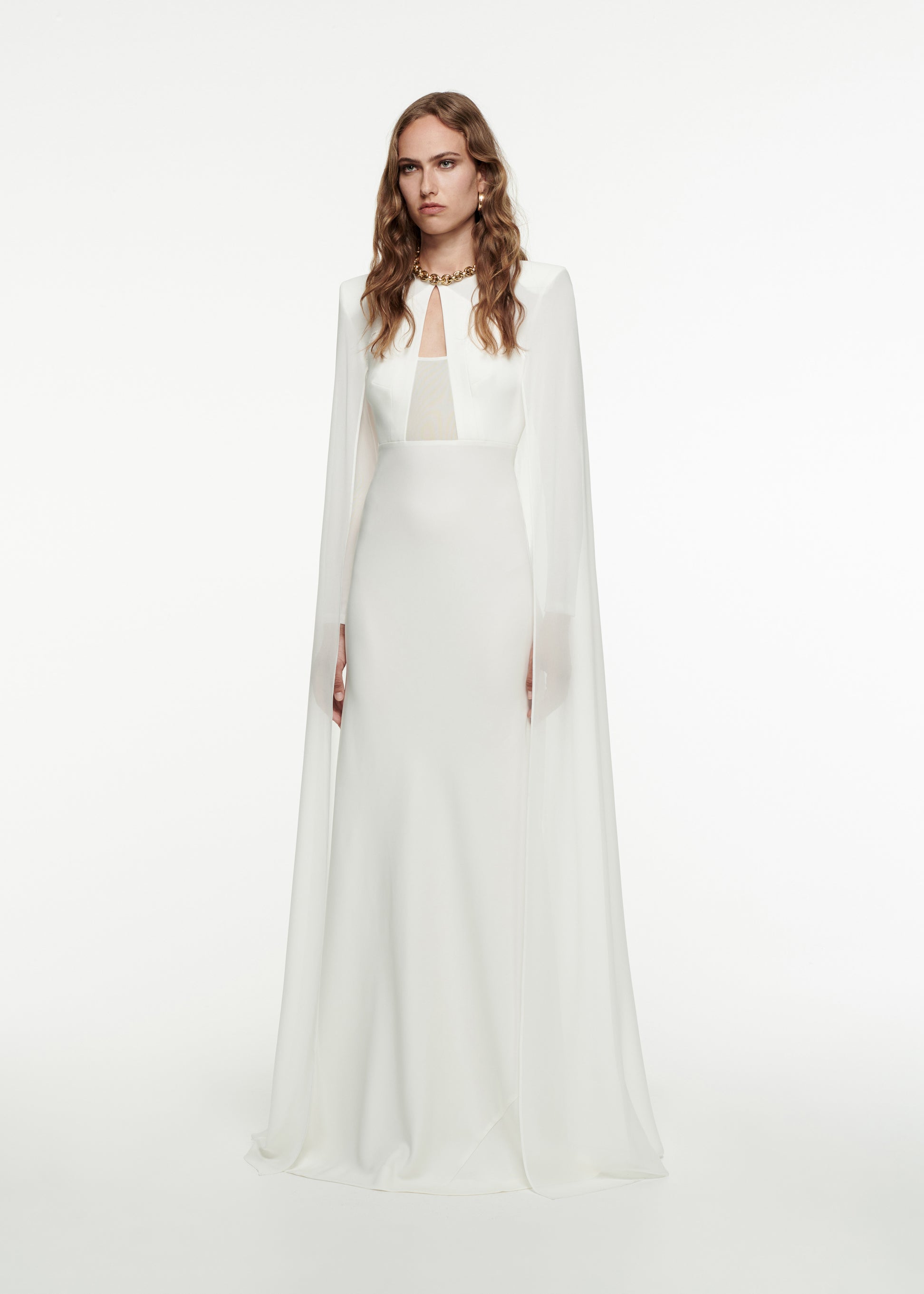 Woman wearing the Long Sleeve Cape Gown in White 