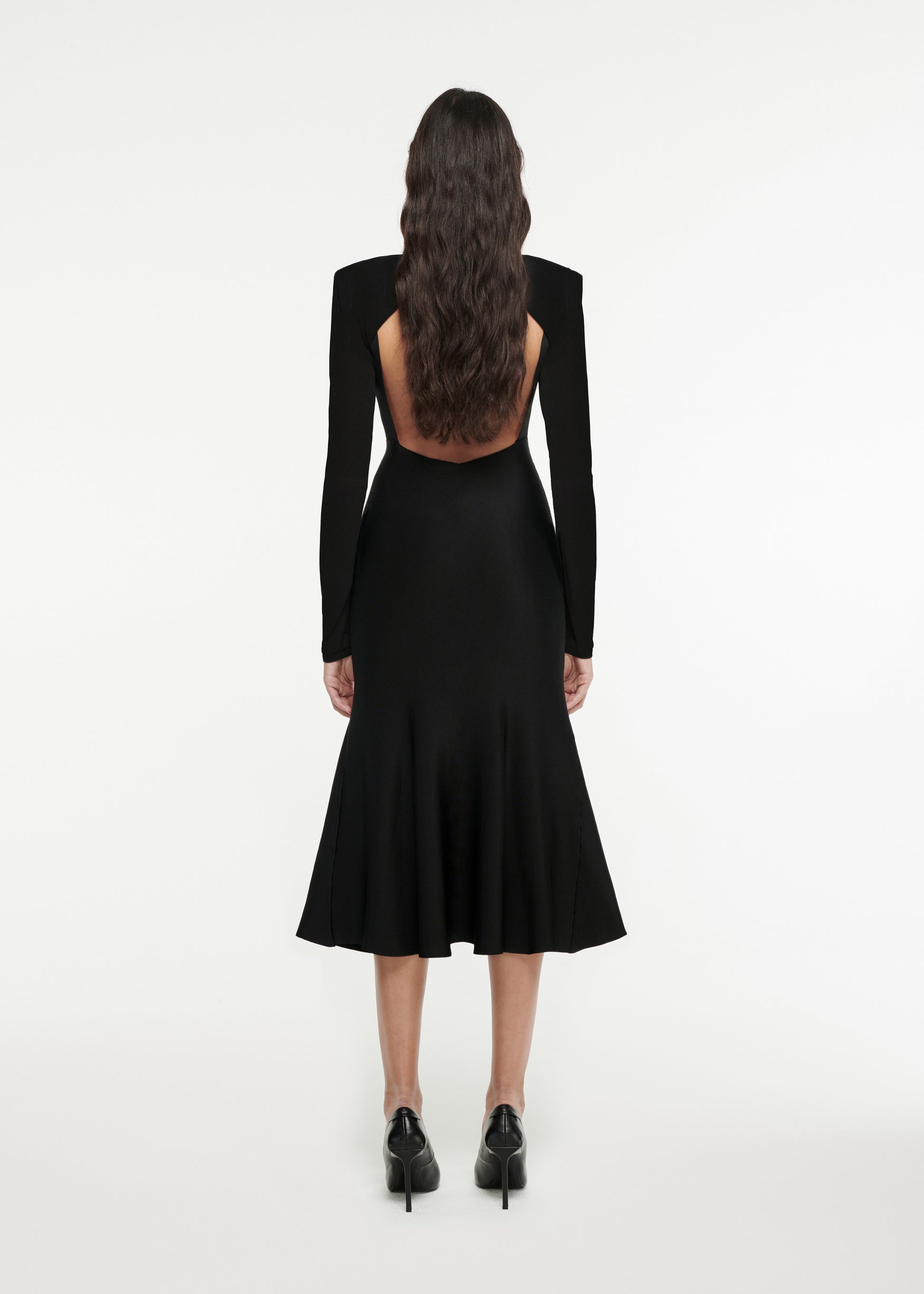 The back of a woman wearing the Detachable Sleeve Knit Midi Dress in Black 