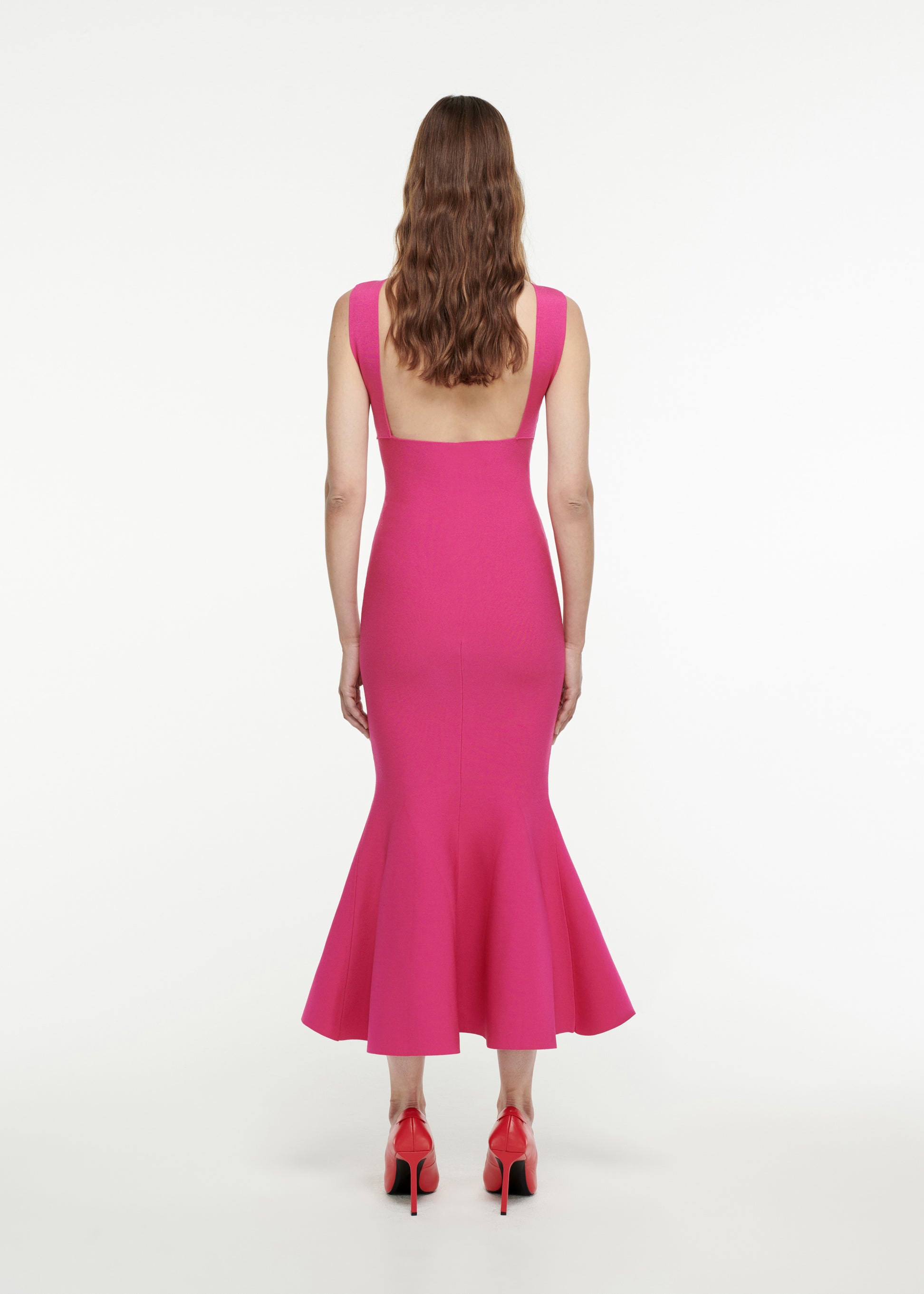 The back of a woman wearing the Knit Midi Dress in Pink 