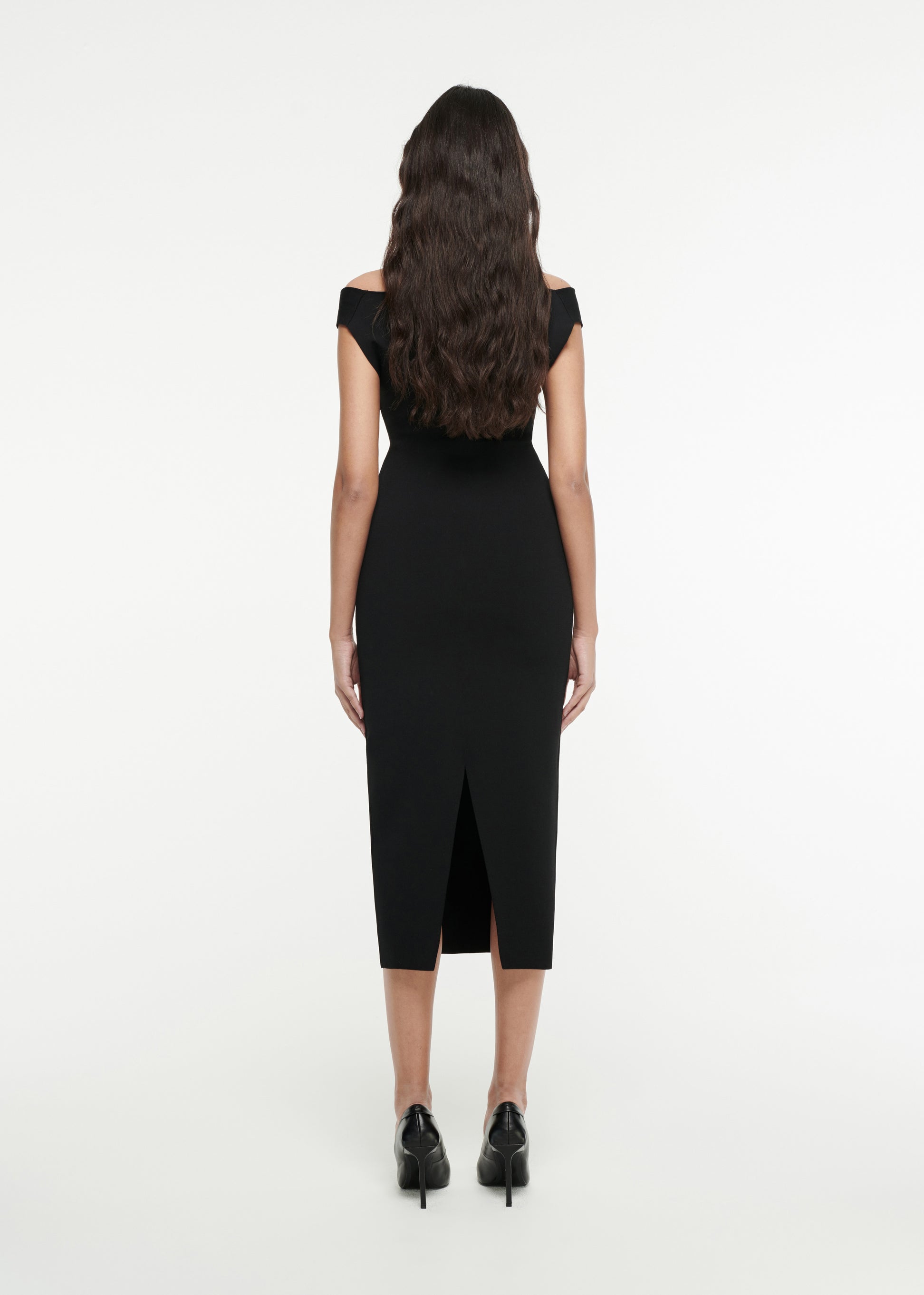 The back of a woman wearing the Off-The-Shoulder Knit Midi Dress in Black 