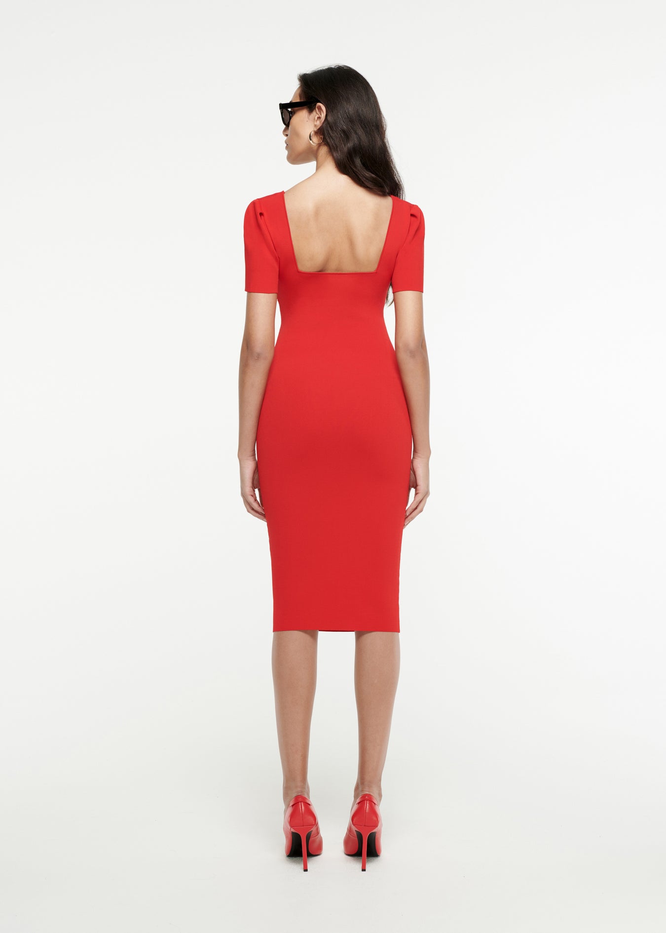 The back of a woman wearing the Short Sleeve Knit Midi Dress in Red