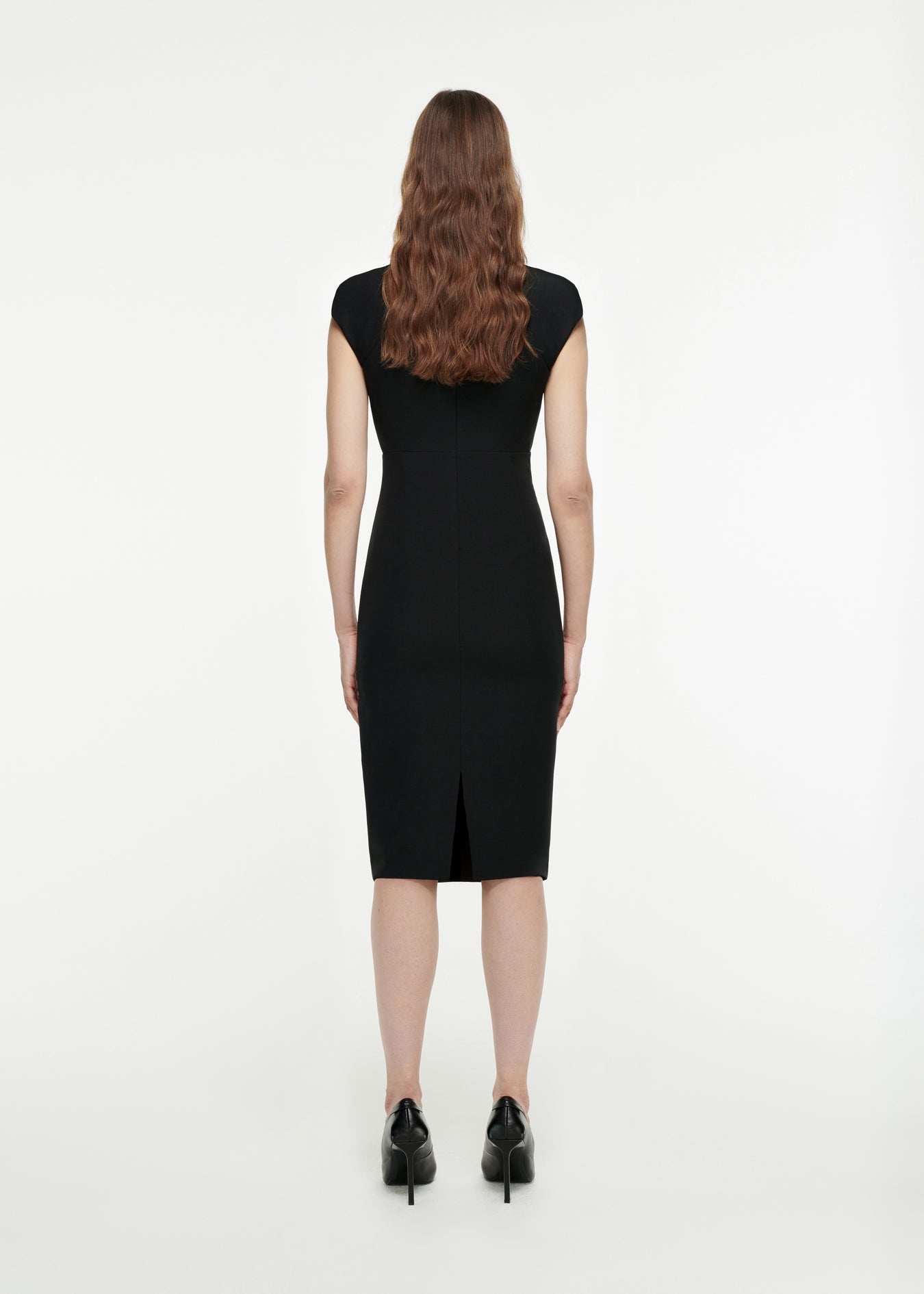 The back of a woman wearing the Cap Sleeve Wool Midi Dress in Black