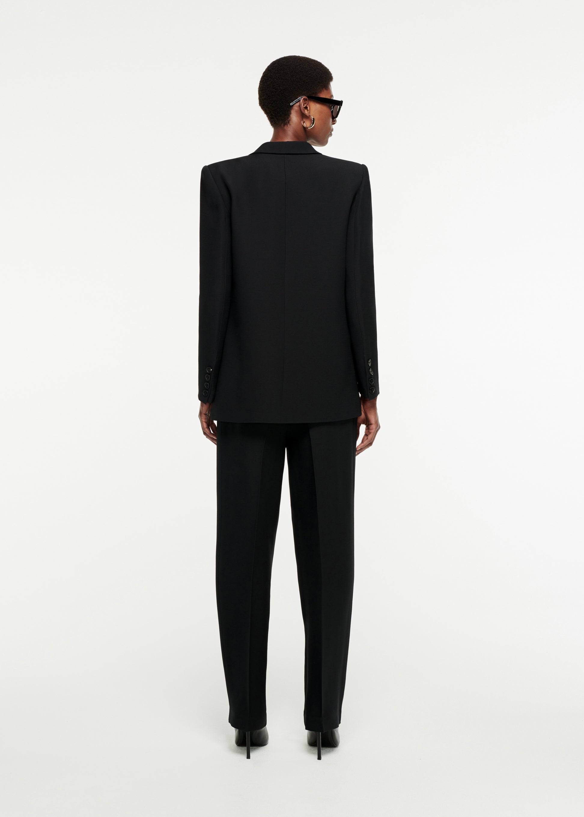 The back of a woman wearing the Straight-Cut Silk Wool Trouser in Black 