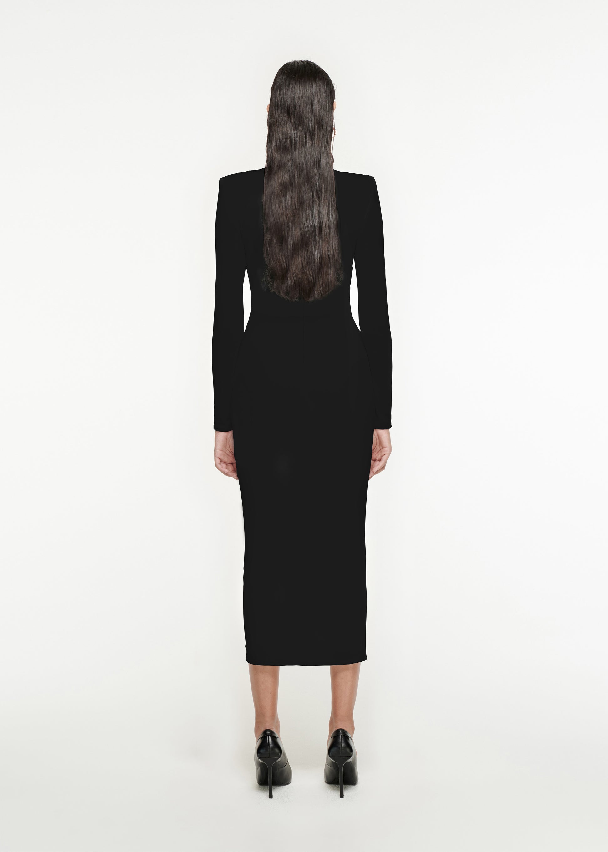 The back of a woman wearing the Long Sleeve Jersey Midi Dress in Black 