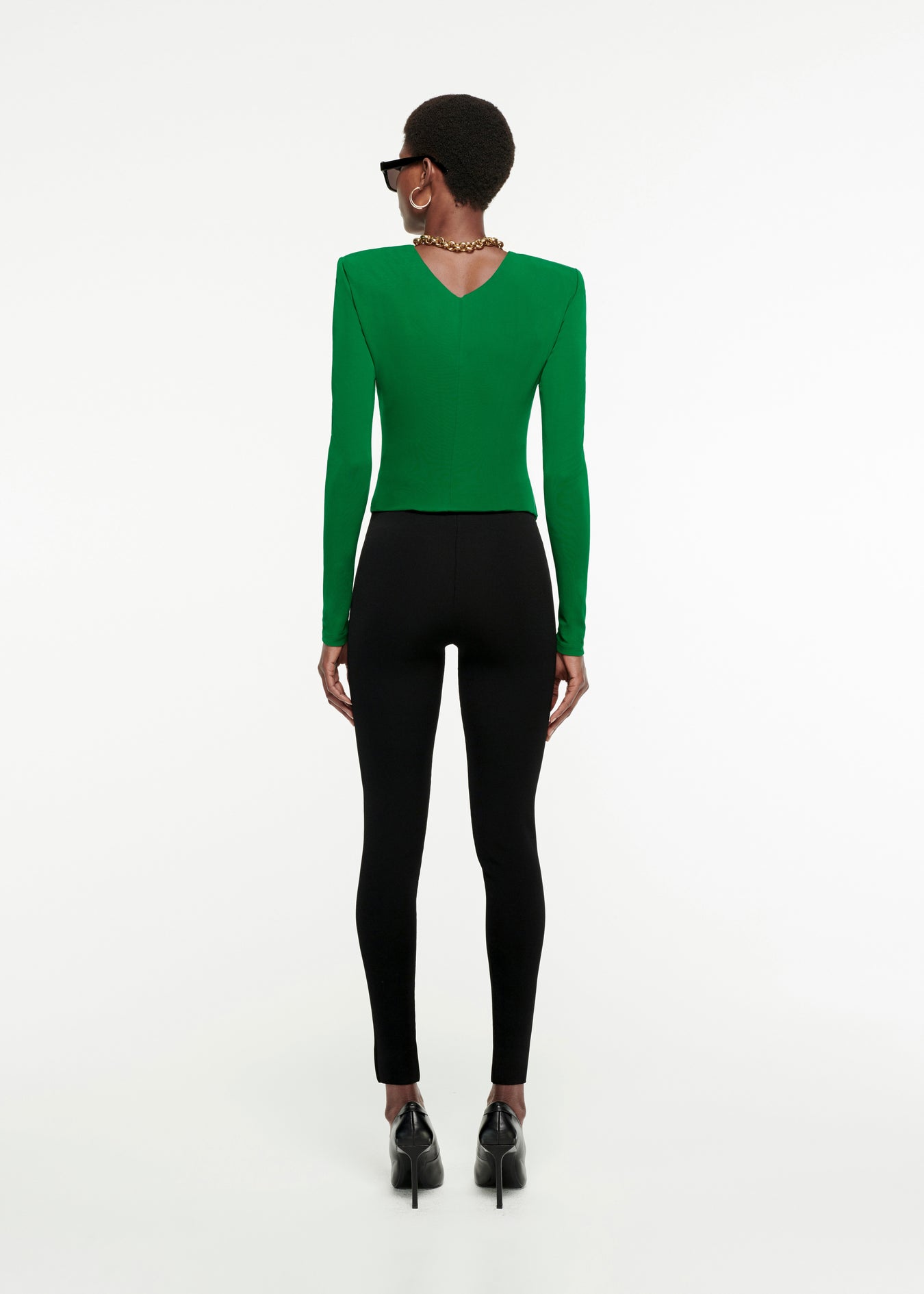 The back of a woman wearing the Long Sleeve Jersey Top in Green 