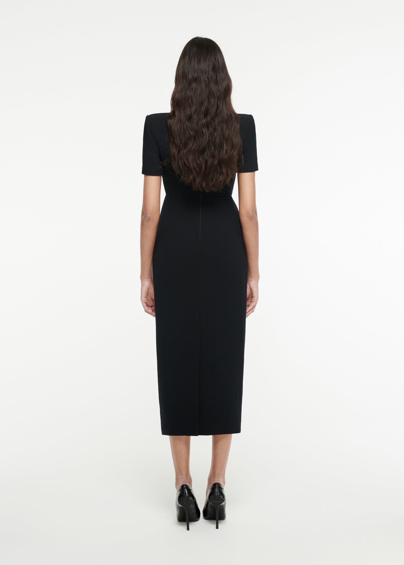 The back of a woman wearing the Short Sleeve Moon Midi Dress in Black 