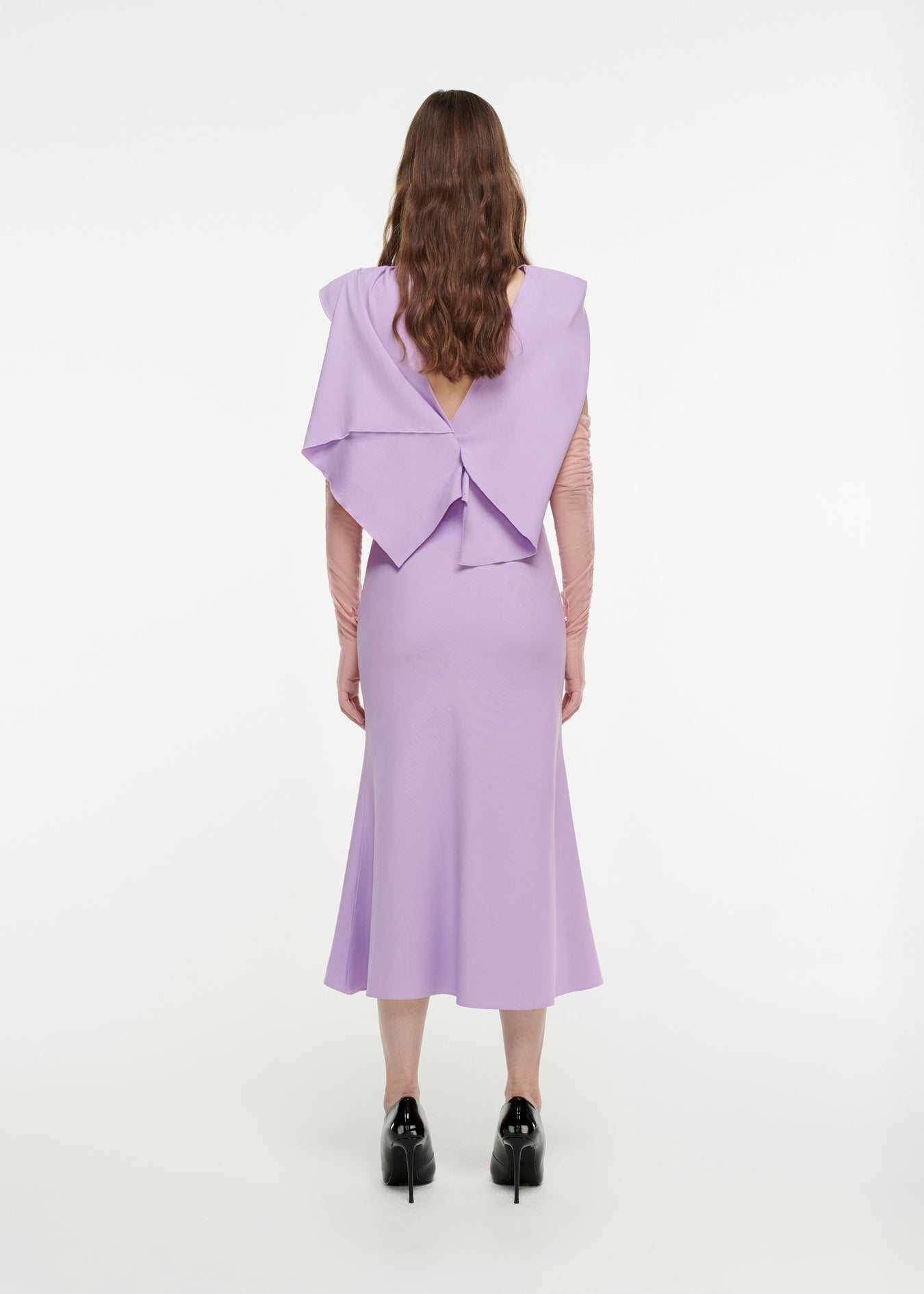 The back of a woman wearing the Draped Stretch-Cady Midi Dress in Lilac