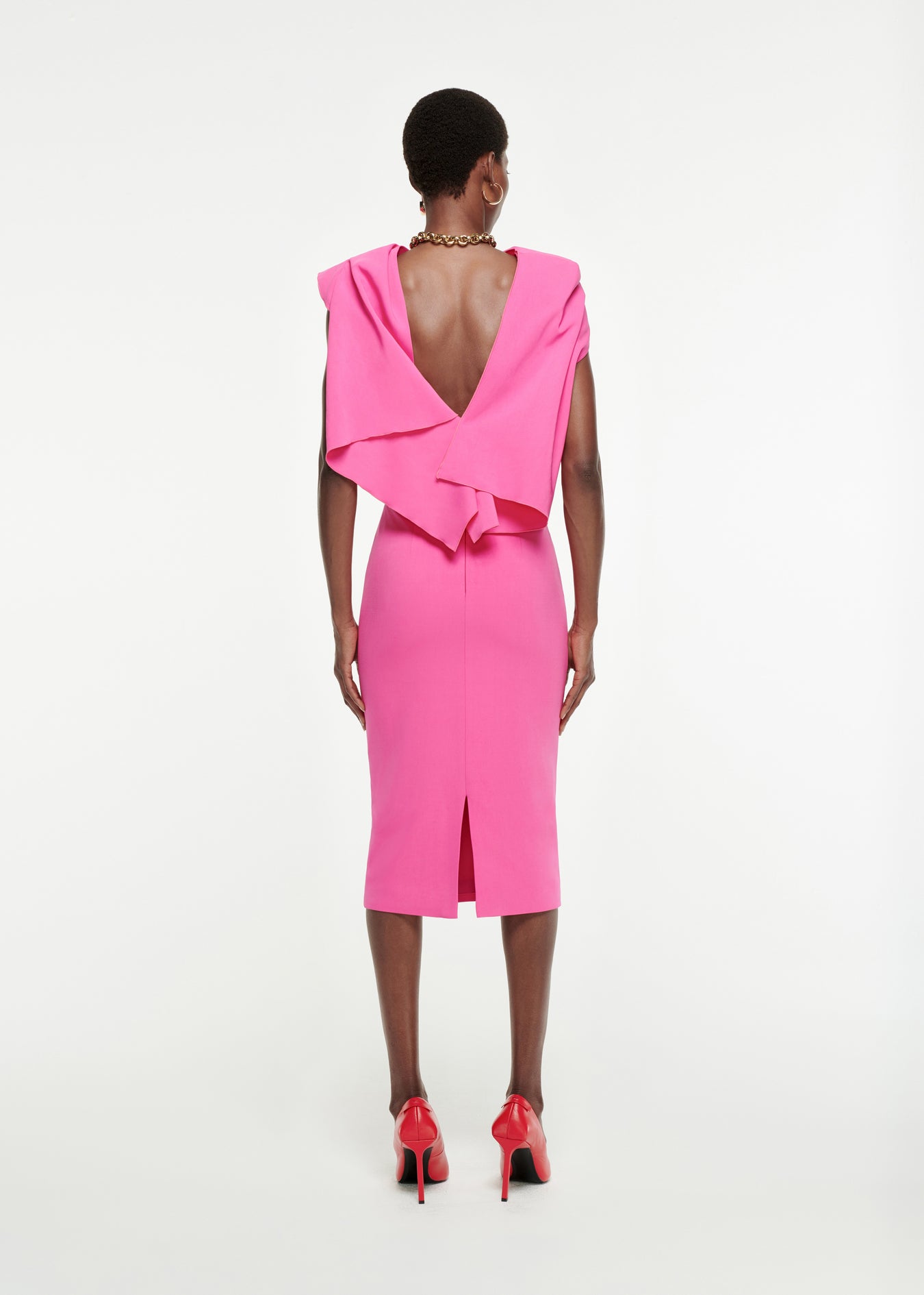 The back of a woman wearing the Draped Stretch-Cady Top in Pink