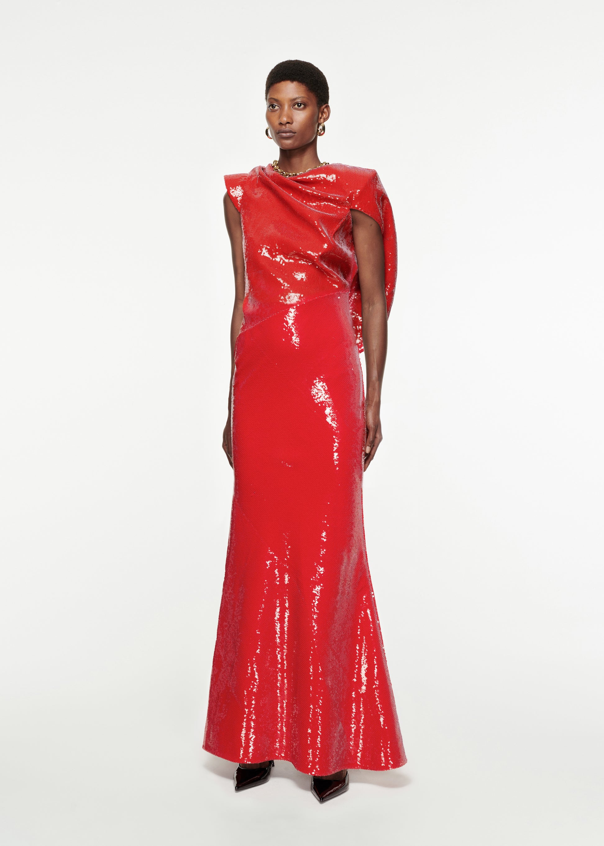 Woman wearing the Draped Sequin Gown in Red