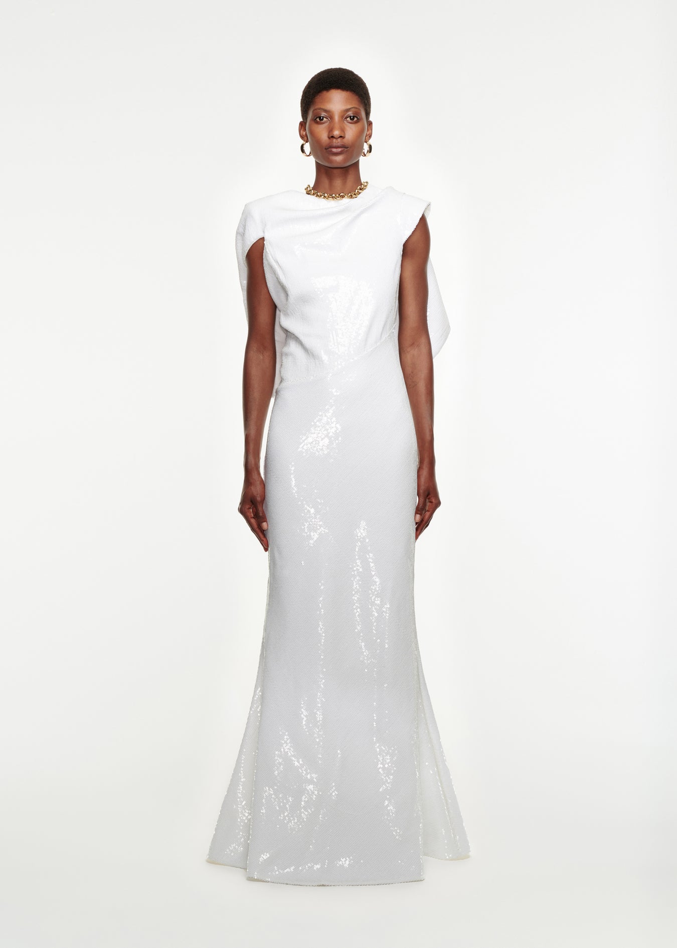 Woman wearing the Draped Sequin Gown in White