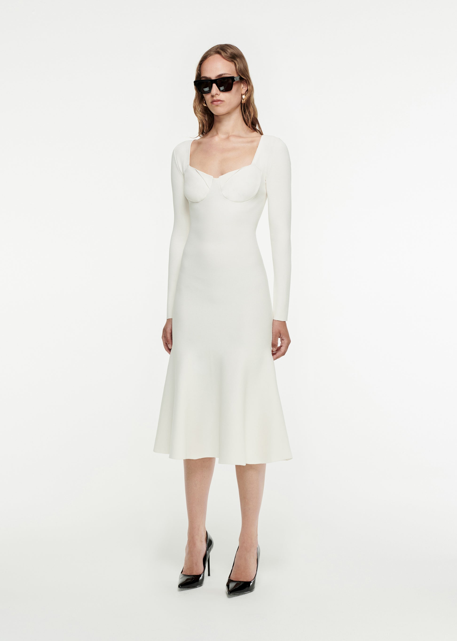 Woman wearing the Long Sleeve Knit Dress in White 
