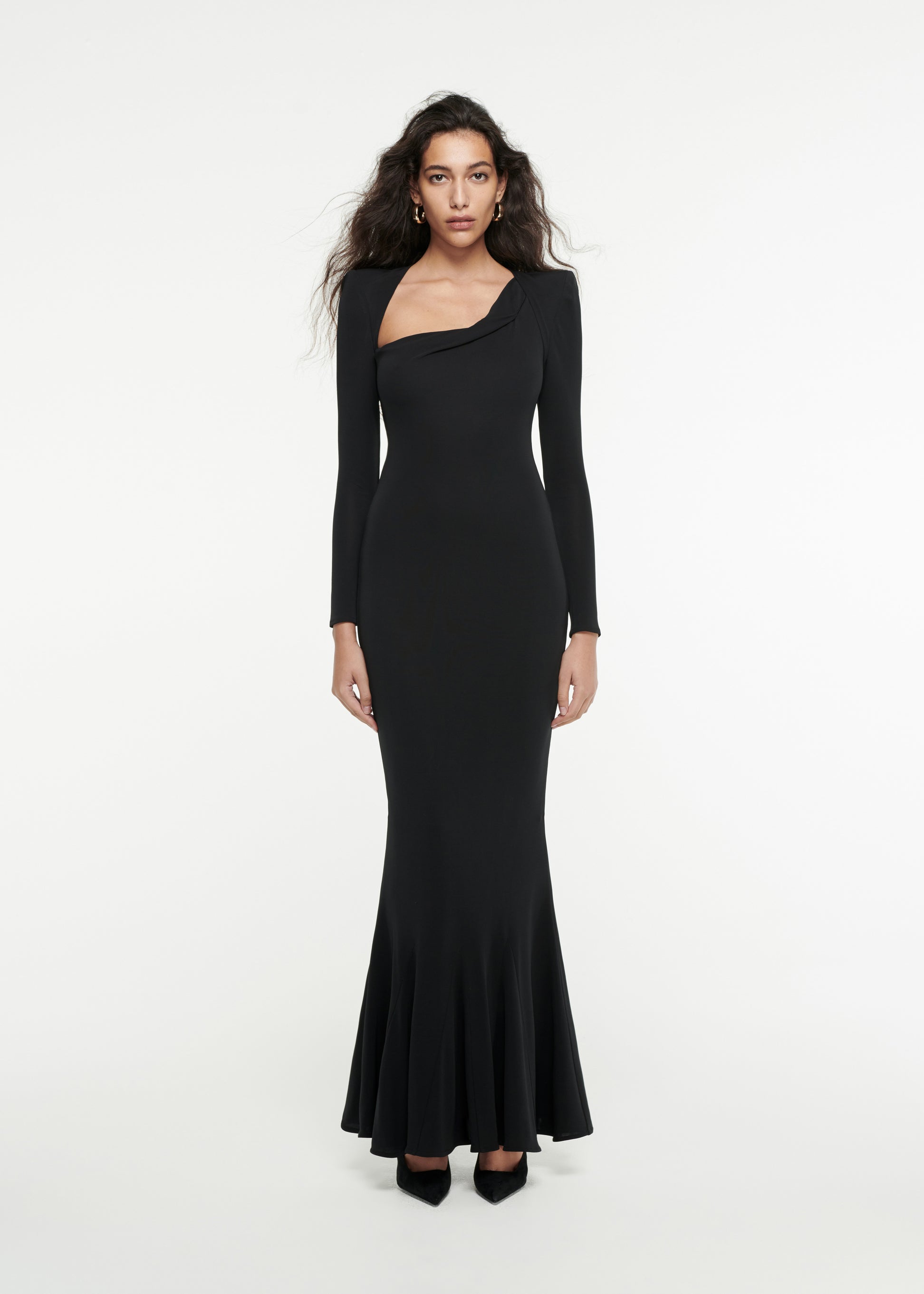 Woman wearing the Long Sleeve Asymmetric Gown in Black 