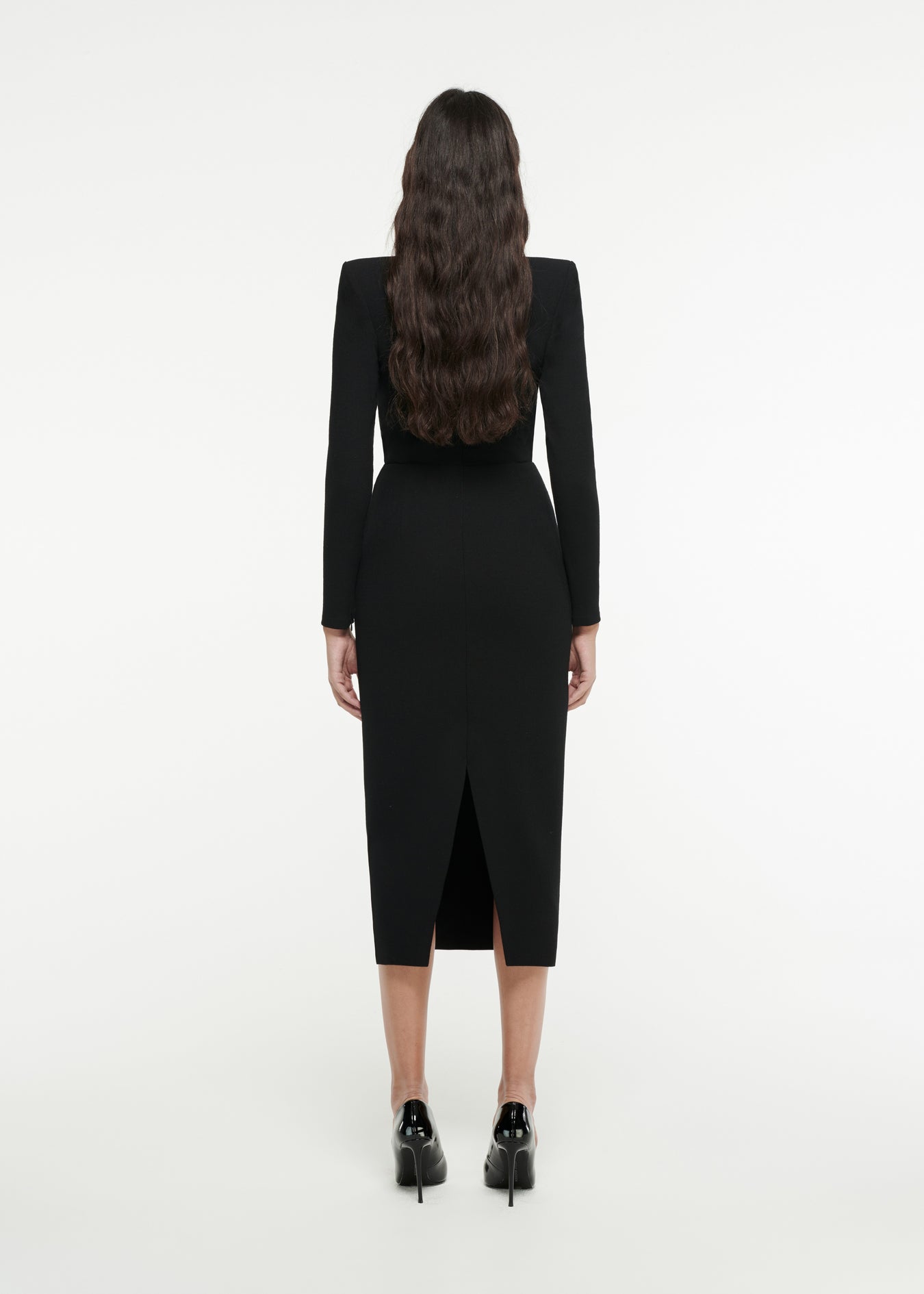 The back of a woman wearing the Long Sleeve Origami Midi Dress in Black 