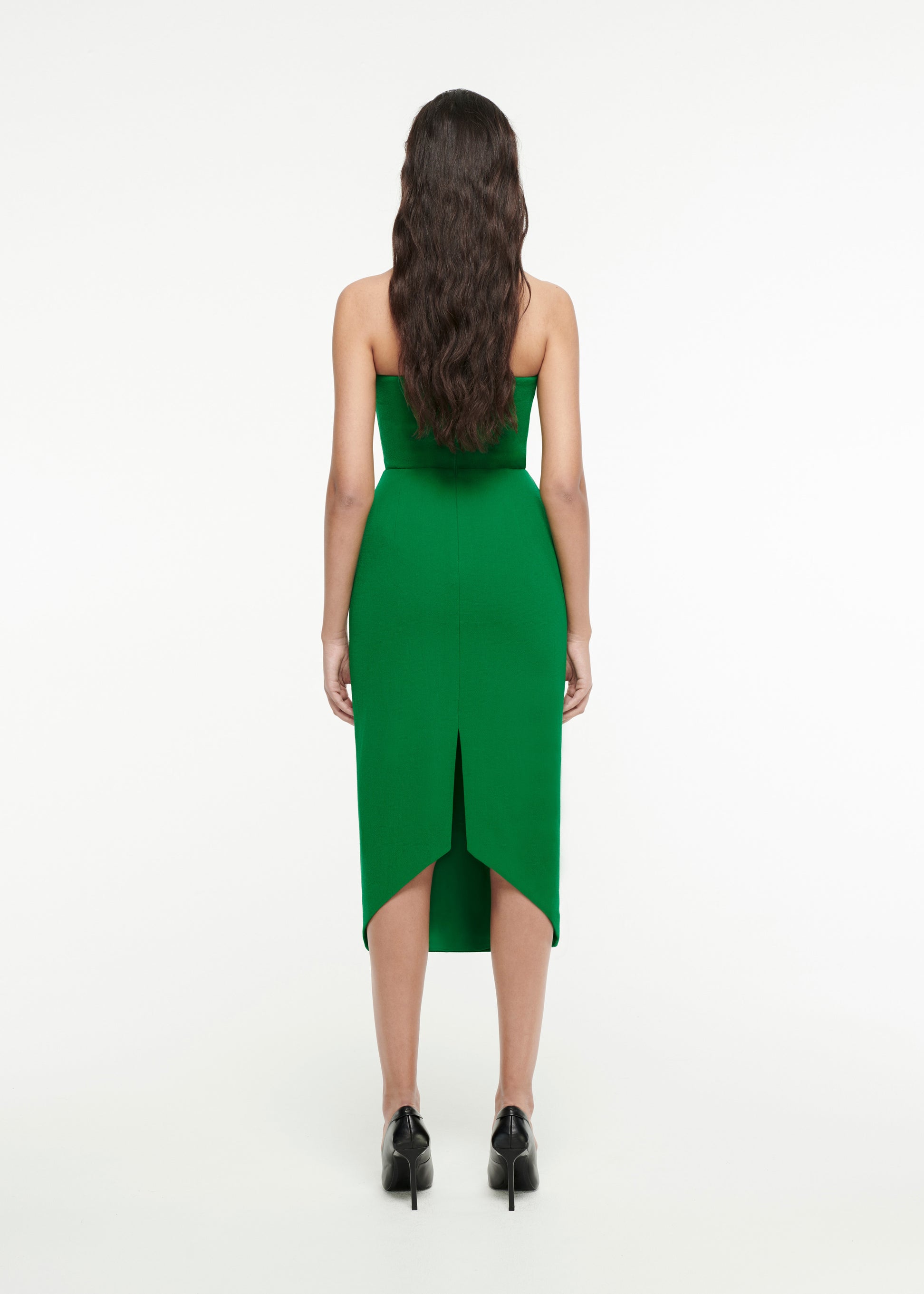 The back of a woman wearing the Strapless Origami Midi Dress in Green 
