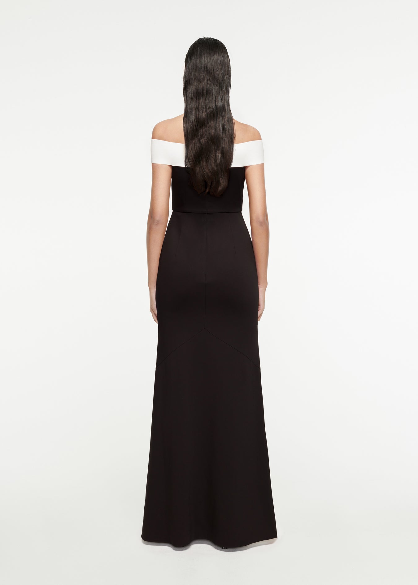 The back of a woman wearing the Off-The-Shoulder Stretch-Cady Gown in Black 