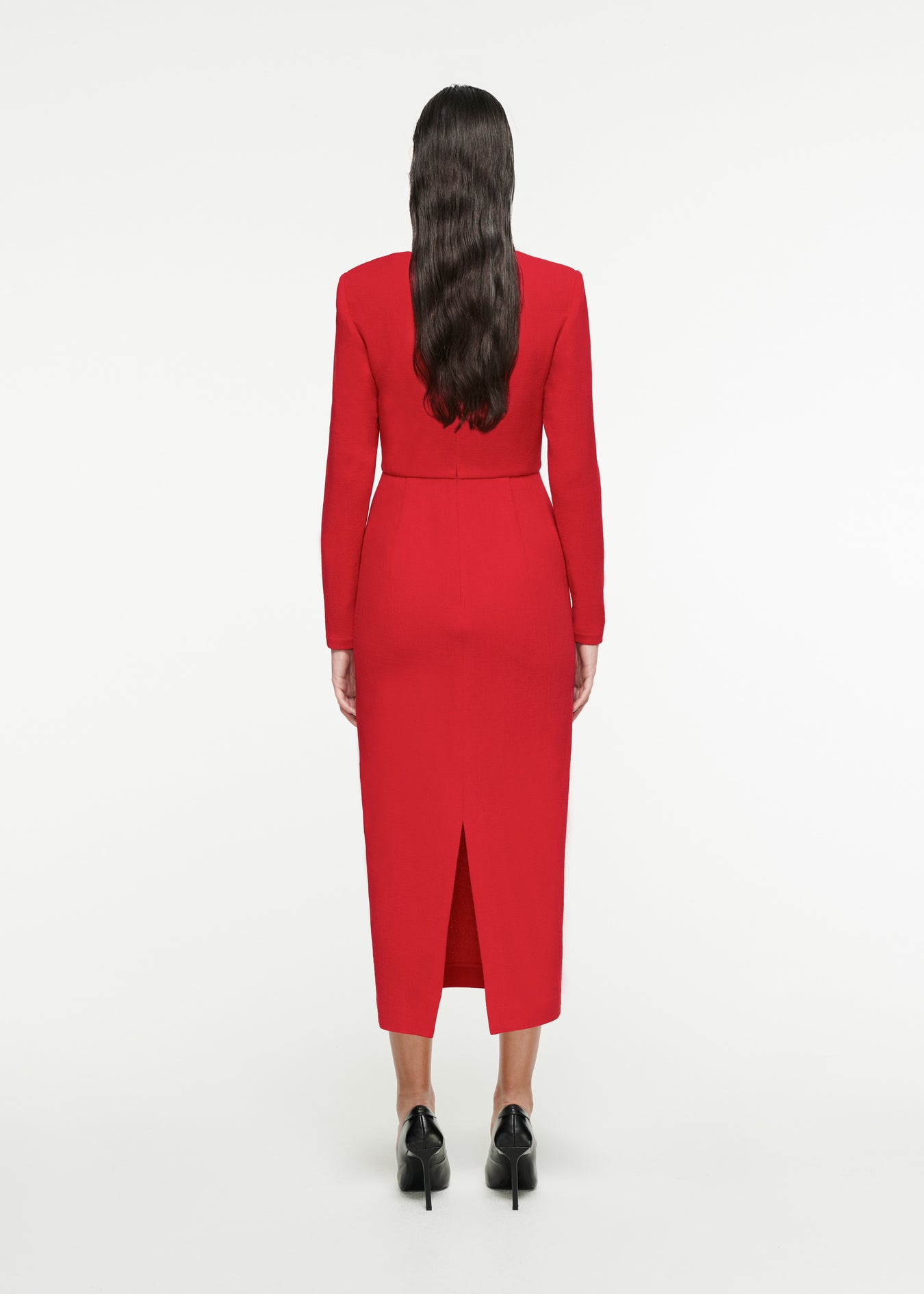 The back of a woman wearing the Long Sleeve Origami Midi Dress in Red