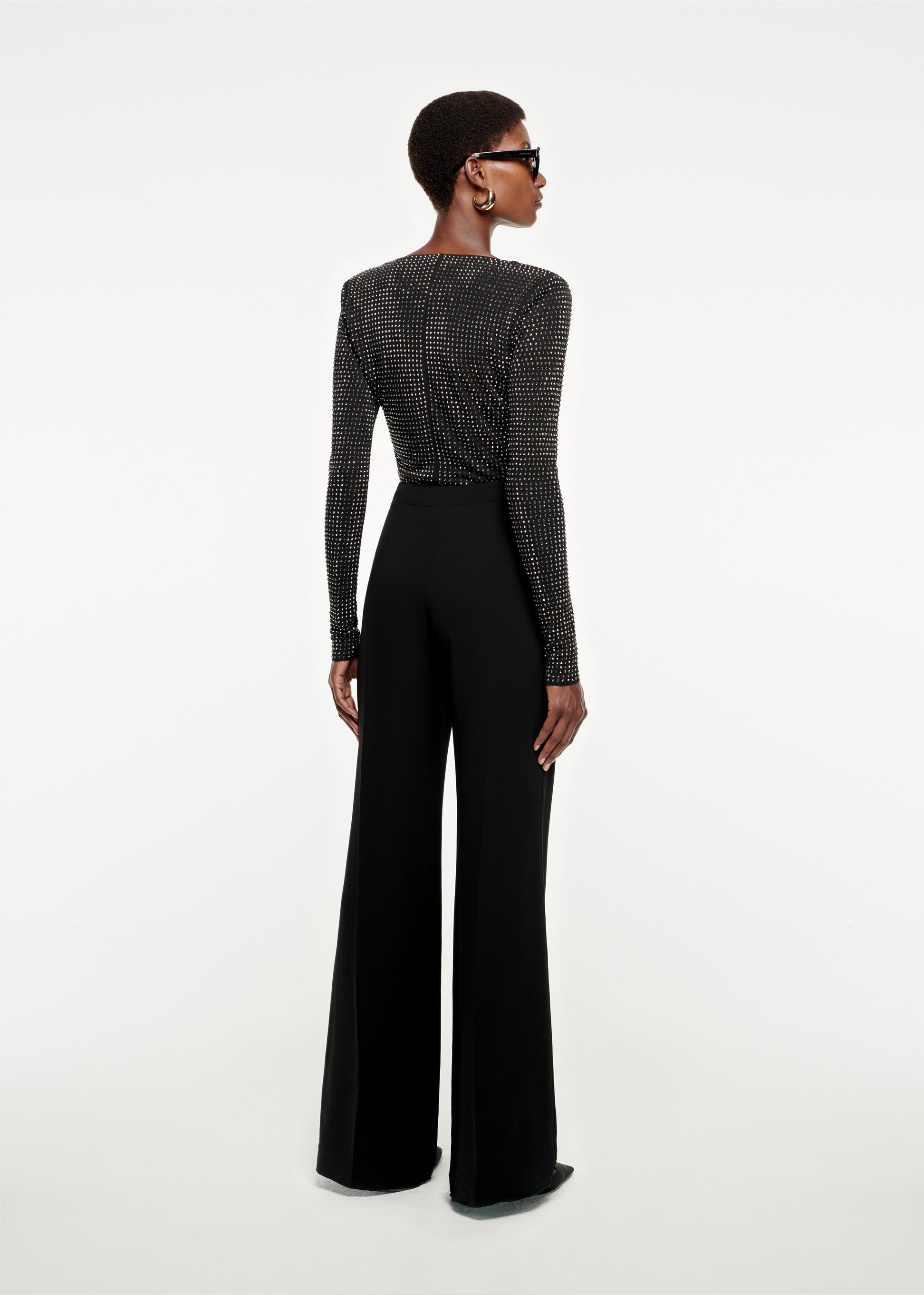 The back of a woman wearing the Wide Leg Stretch-Cady Trouser in Black