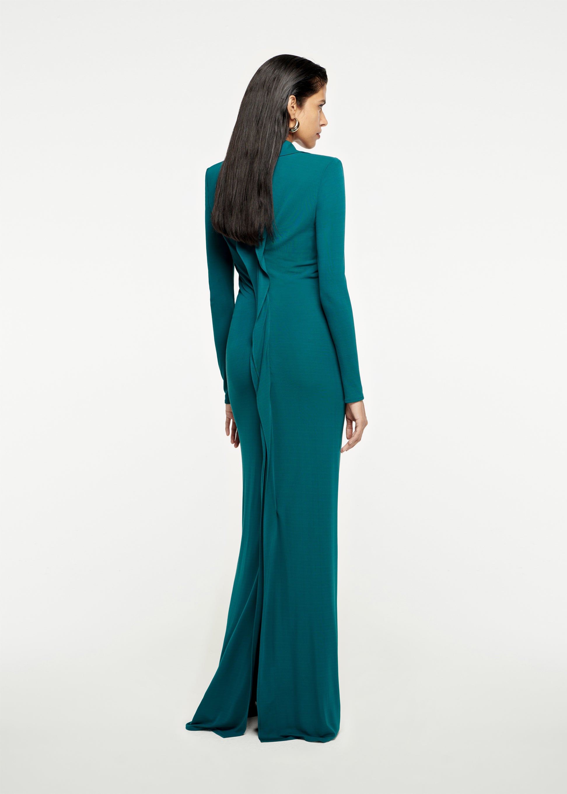 The back of a woman wearing the Long Sleeve Jersey Maxi Dress Dark in Green 