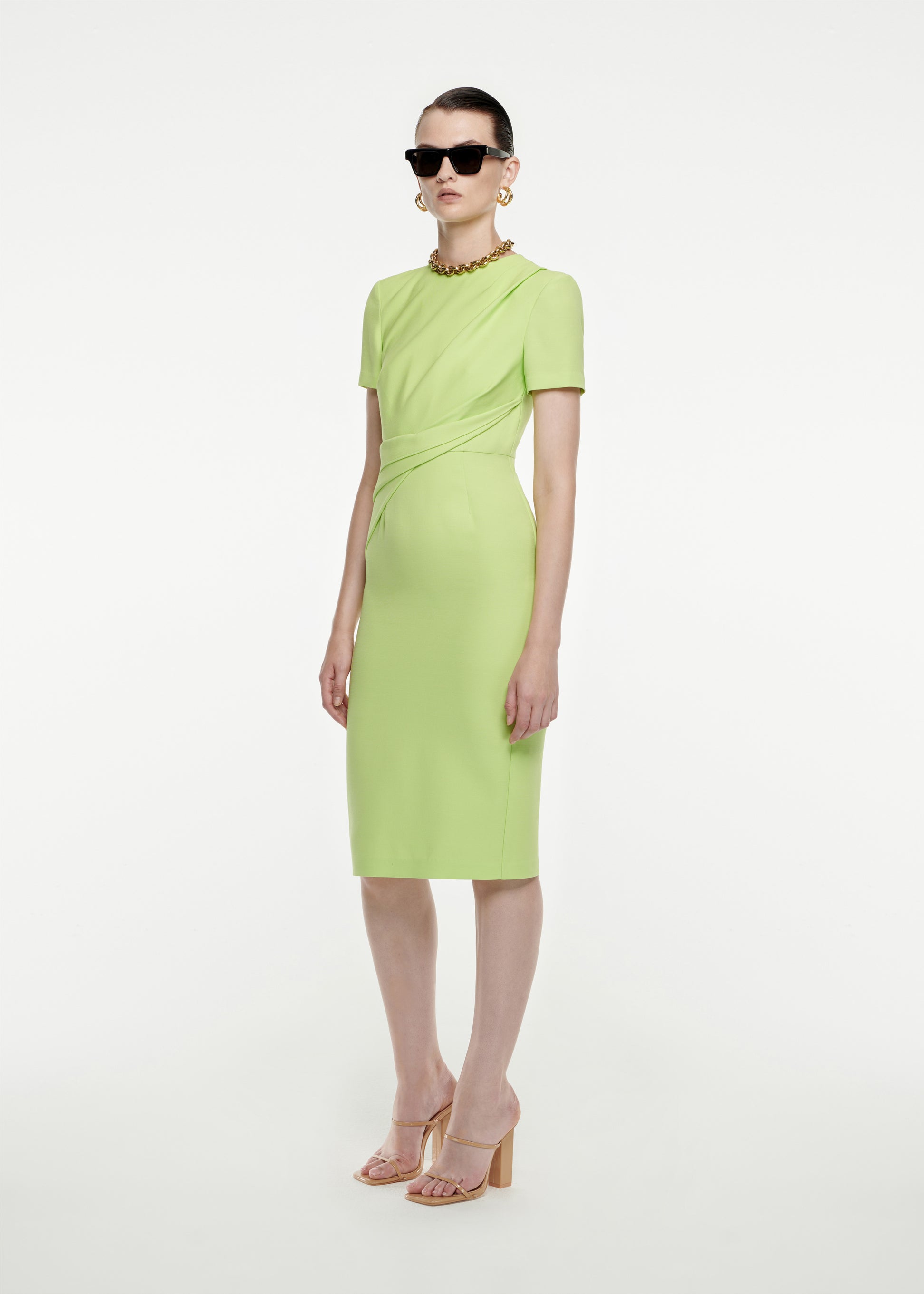 Woman wearing the Short Sleeve Silk Wool Midi Dress in Green